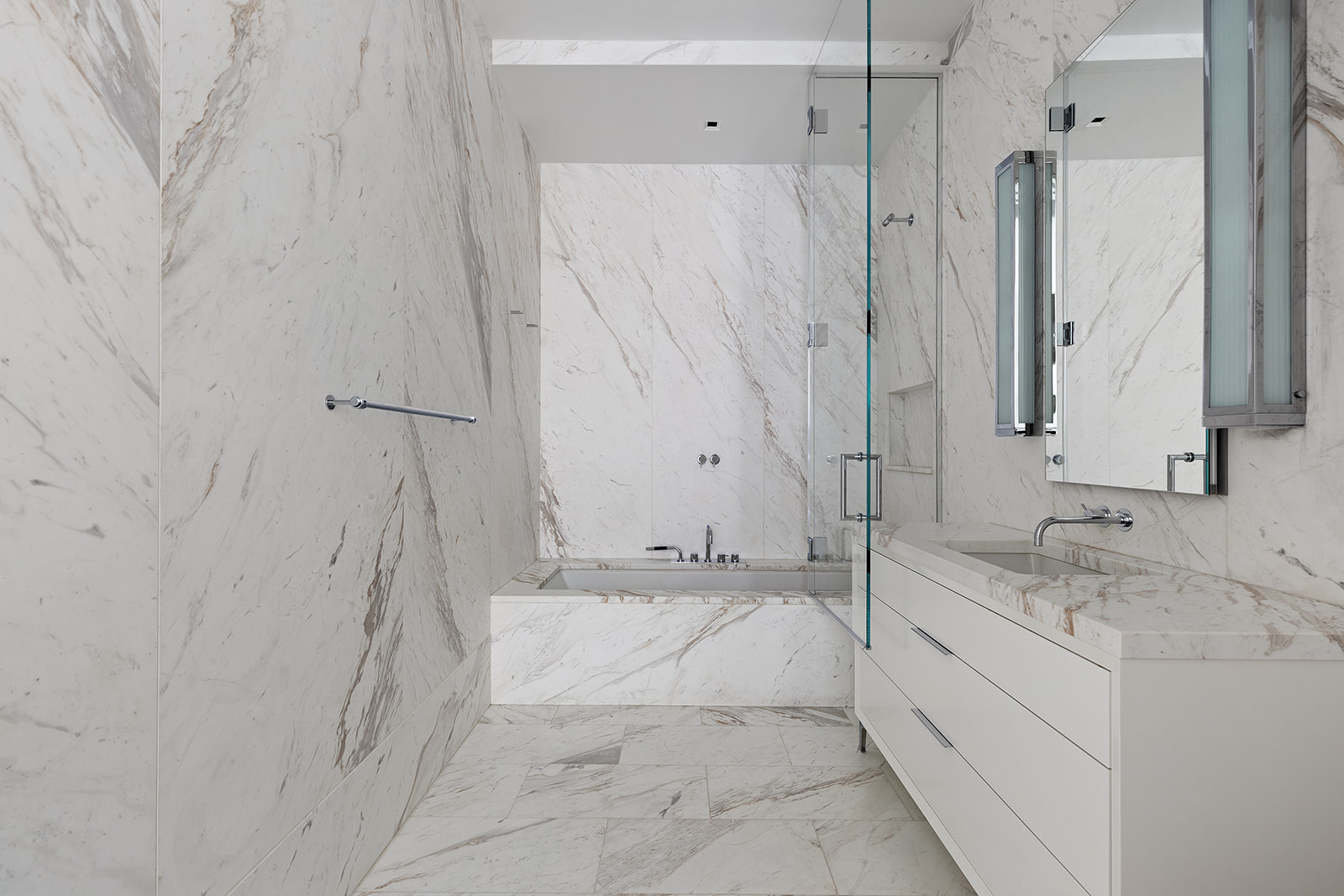 601 Washington Street, Unit 3W Manhattan, NY 10014 - Photo 13 of 15 a bathroom with a granite countertop sink mirror and a shower