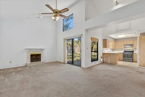 a view of a kitchen with a sink and a window