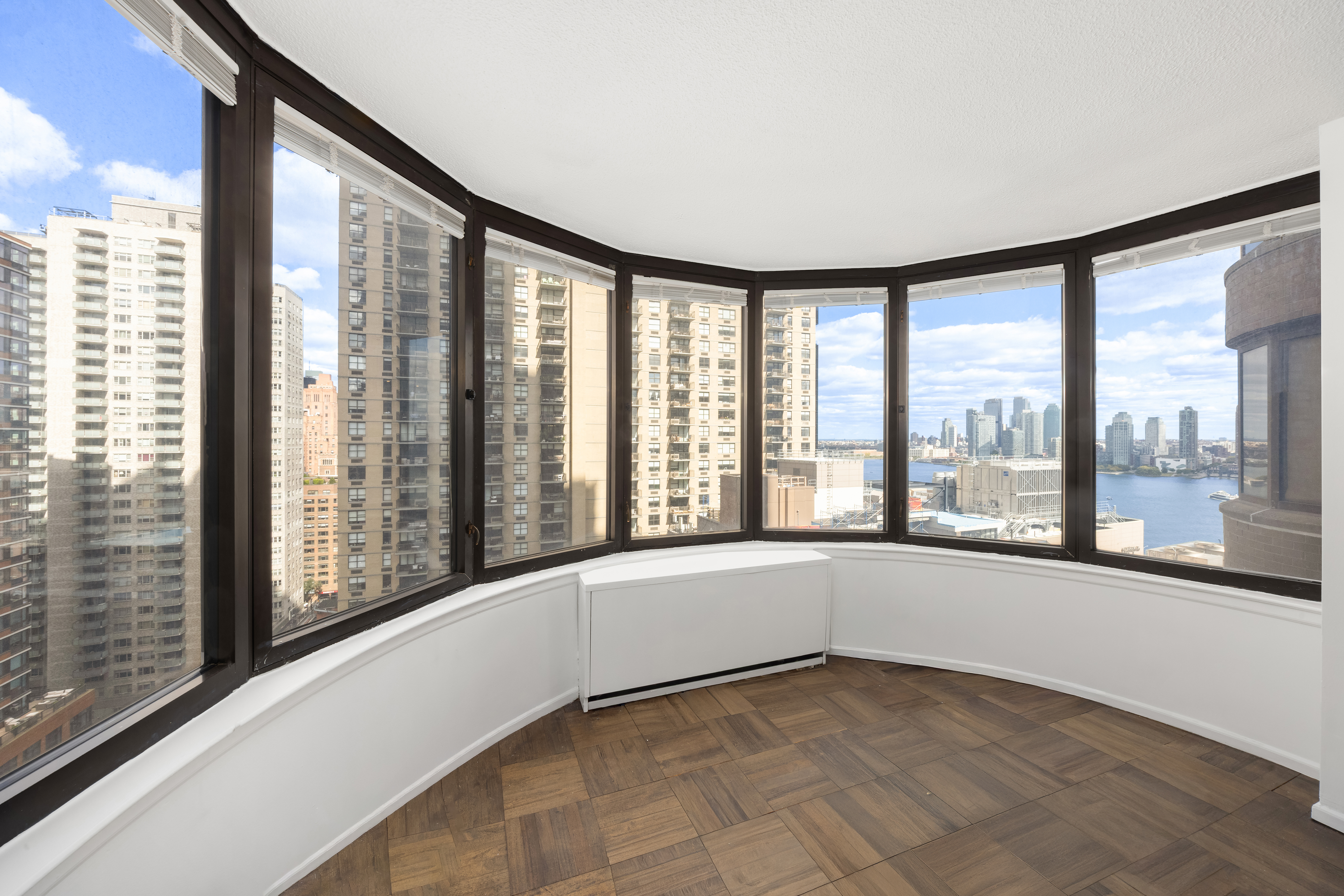 330 East 38th Street, Unit 22H Manhattan, NY 10016 - Photo 5 of 11 a view of an empty room with a large window