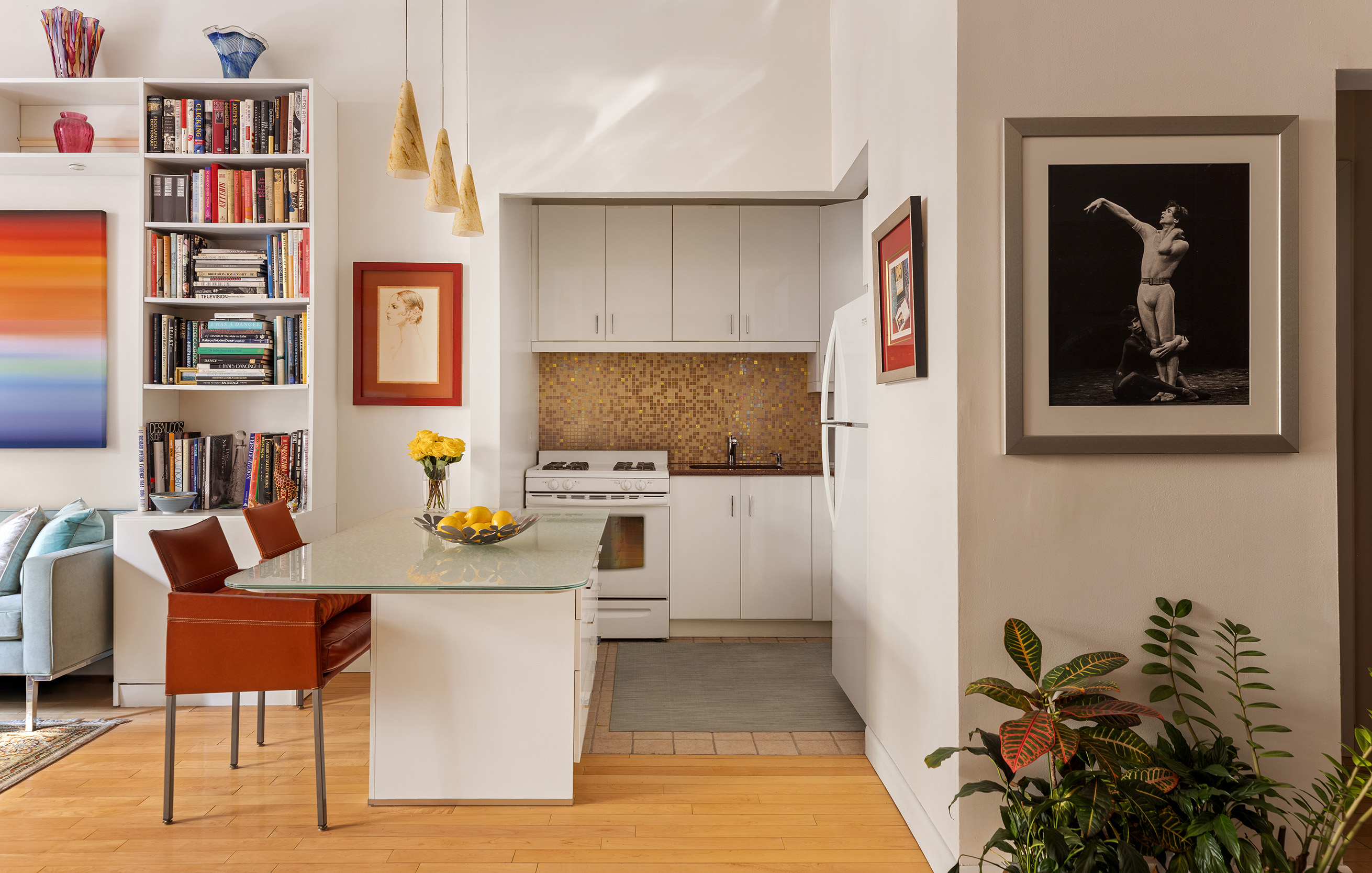 21 East 22nd Street, Unit 2K Manhattan, NY 10010 - Photo 5 of 13 a living room with furniture and a book shelf