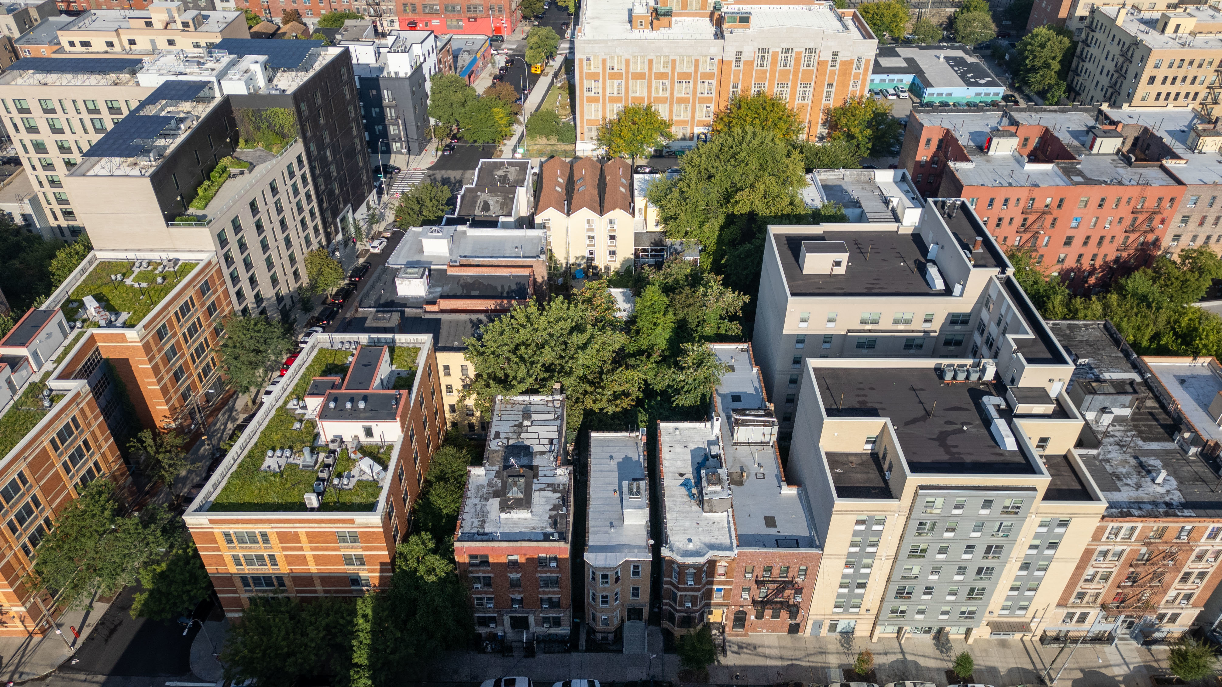 2023 Hughes Avenue Bronx, NY 10457 - Photo 34 of 63 an aerial view of residential houses with outdoor space