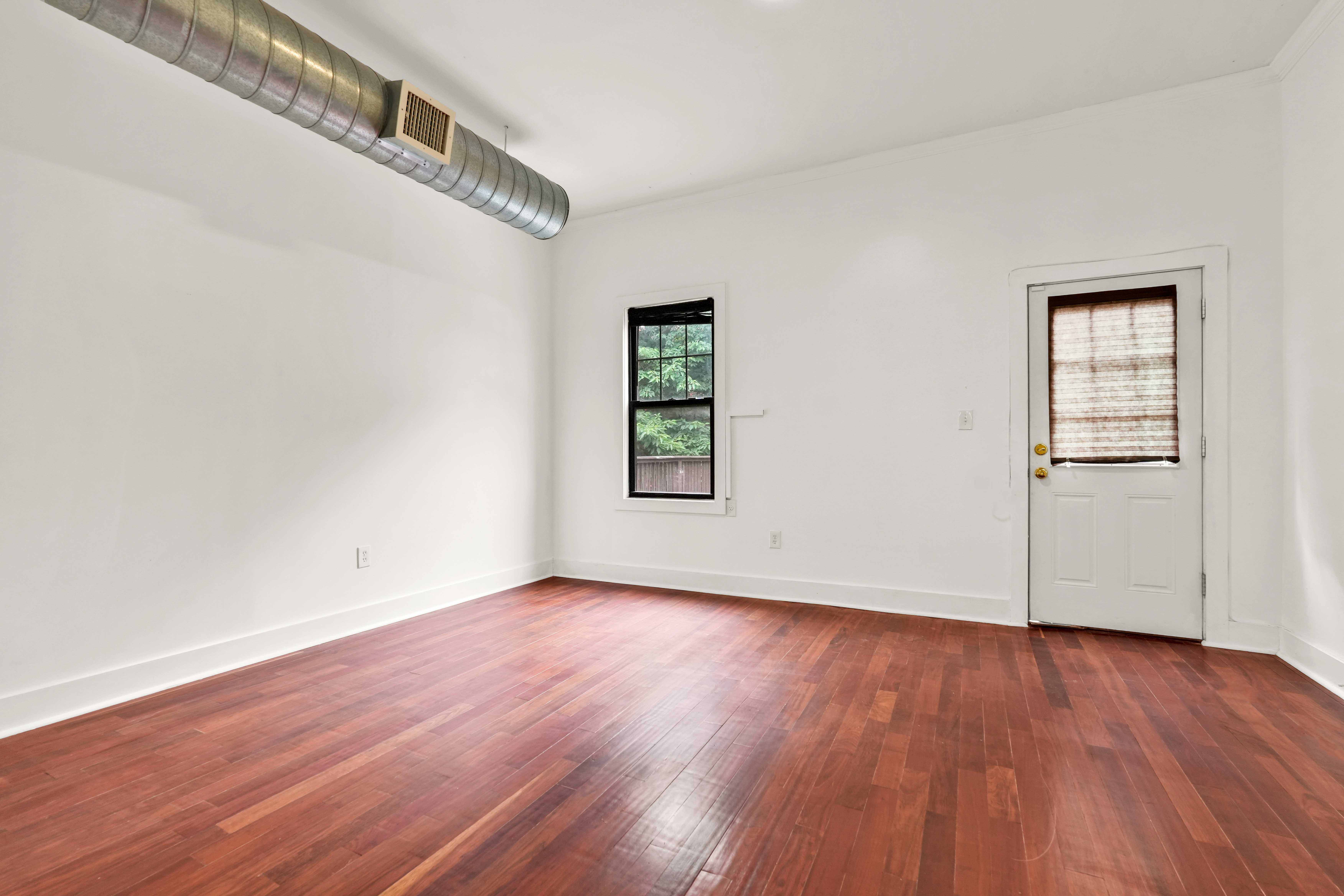 17 A Suydam Place, Unit 2 Brooklyn, NY 11233 - Photo 5 of 28 an empty room with wooden floor and windows