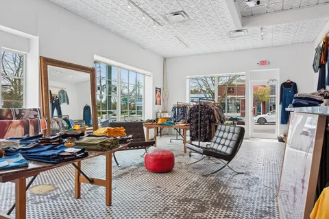 a living room with lots of furniture and a flat screen tv