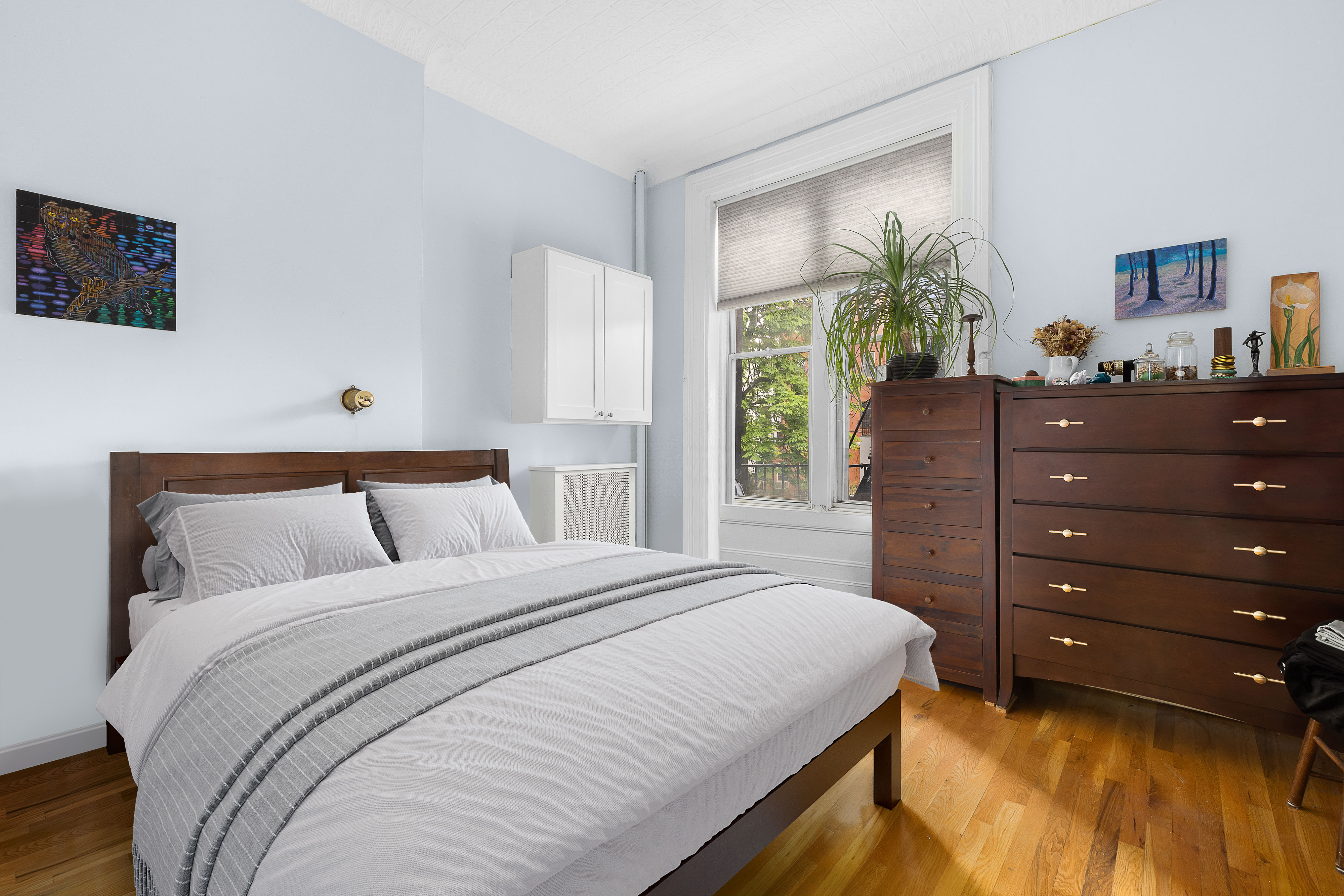 144 Baltic Street Brooklyn, NY 11201 - Photo 12 of 14 a bedroom with a bed and a window