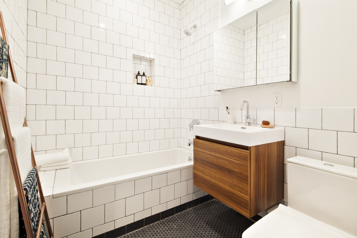629 Grand Street, Unit 4A Brooklyn, NY 11211 - Photo 5 of 7 a bathroom with a sink and a bathtub