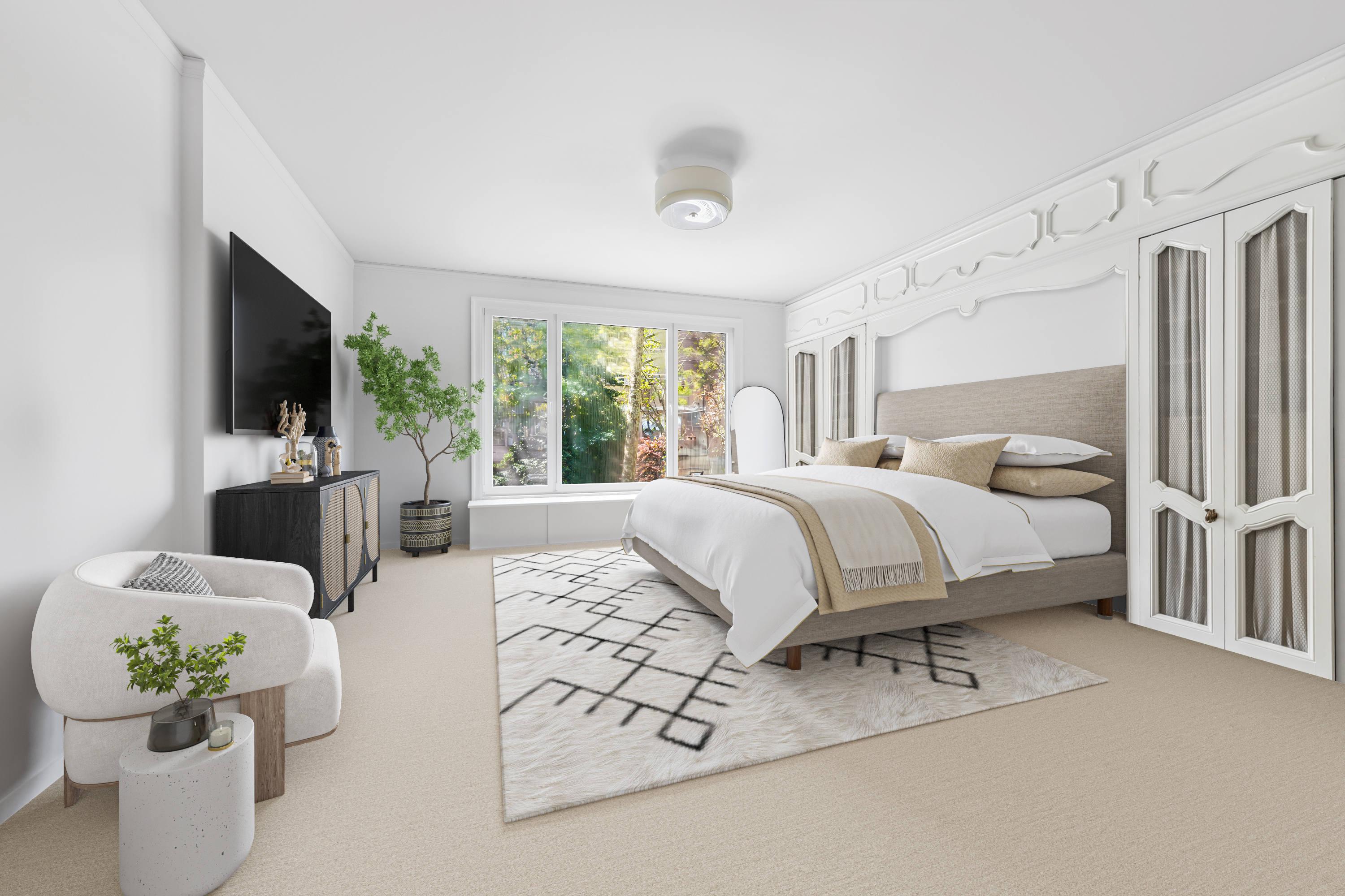 240 East 62nd Street Manhattan, NY 10065 - Photo 6 of 12 a bedroom with furniture and a flat screen tv