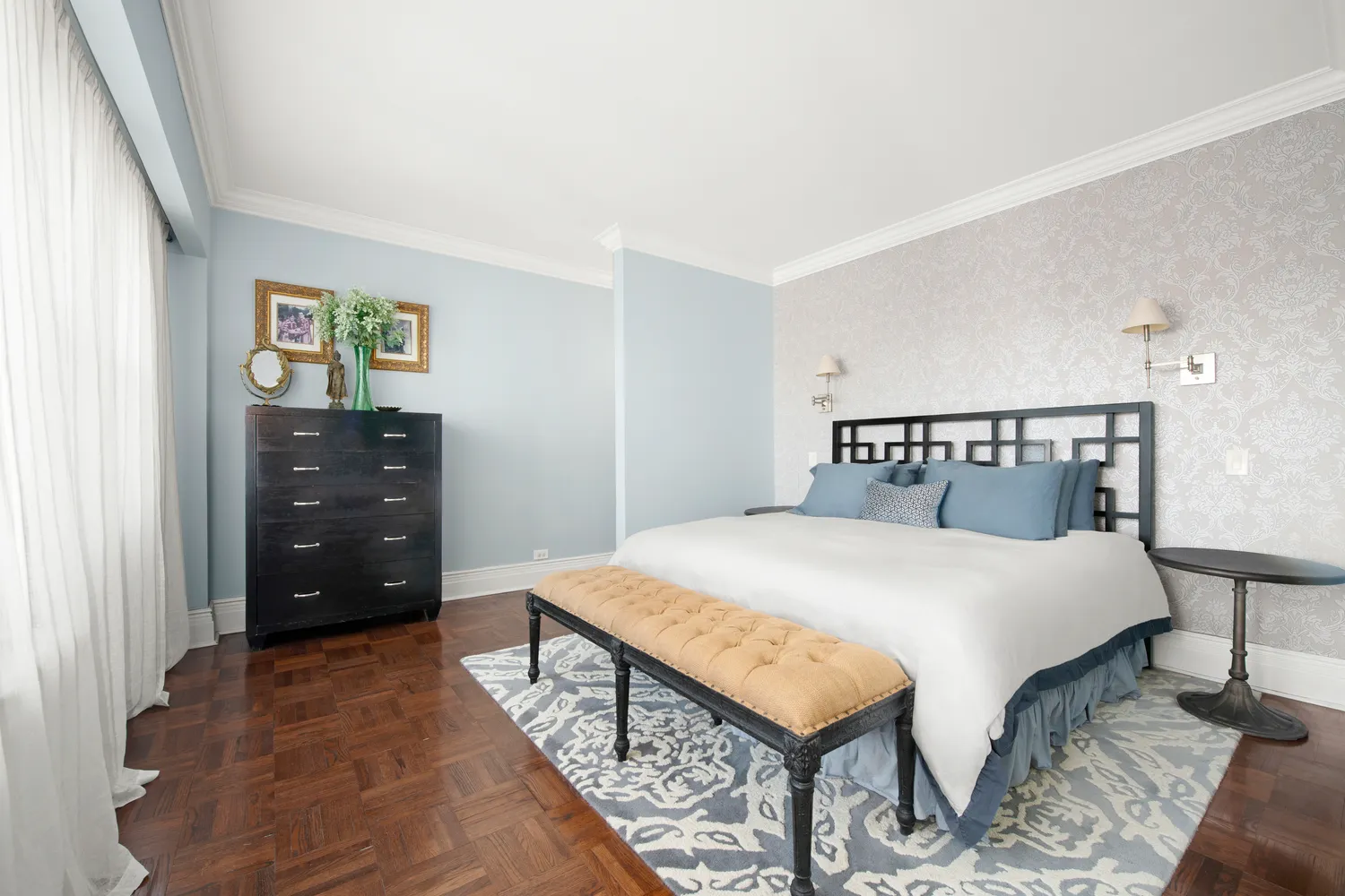 a bedroom with a bed and a dresser