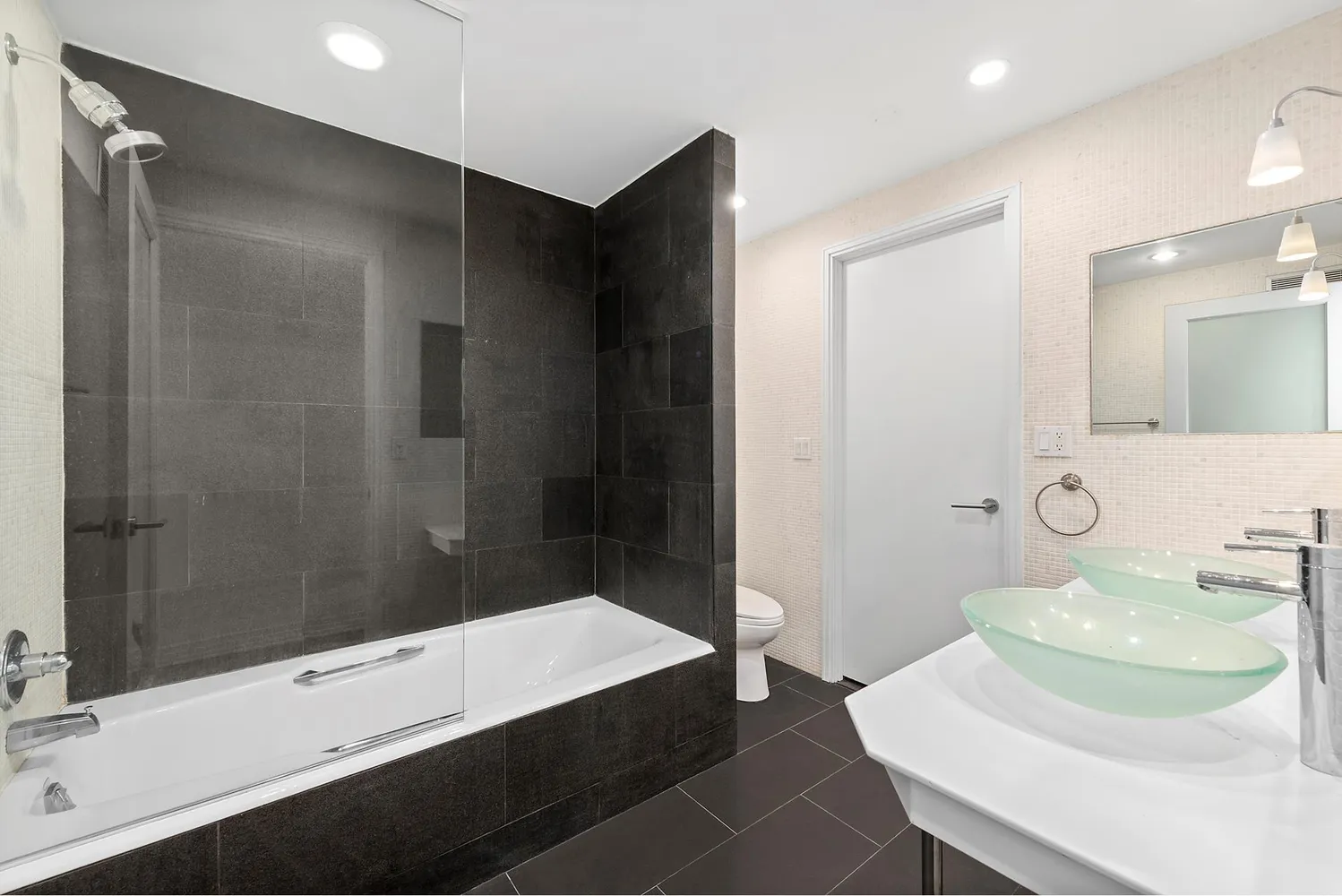 a bedroom with a bed and a potted plant