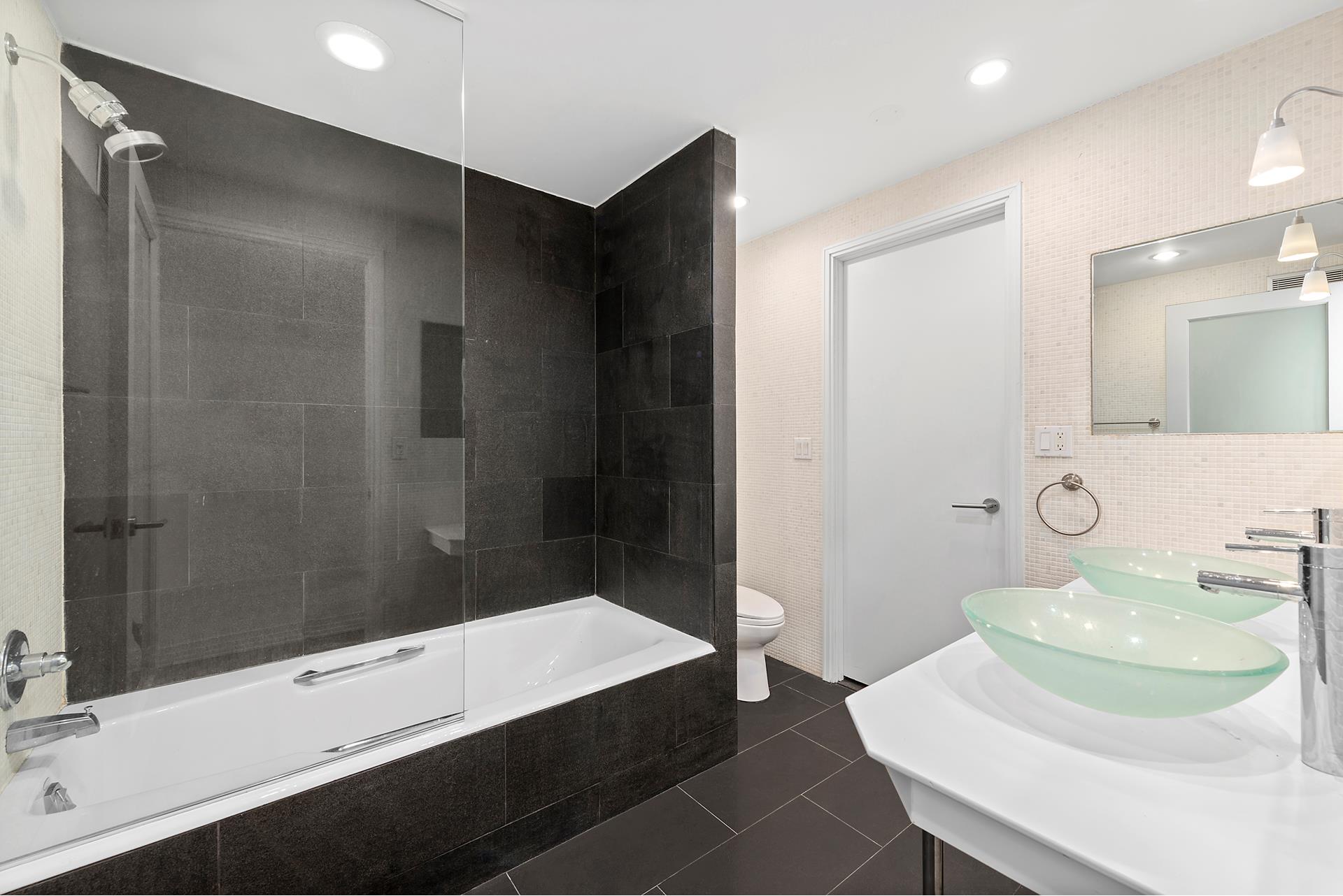 53 Murray Street, Unit 1 Manhattan, NY 10007 - Photo 8 of 15 a bathroom with a sink and a mirror