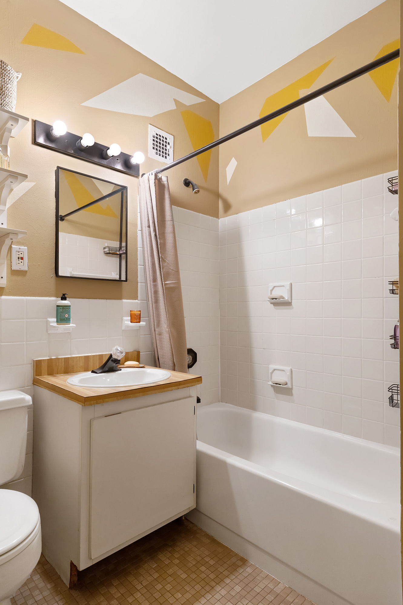 3 Hanover Square, Unit 14EF Manhattan, NY 10004 - Photo 13 of 14 a bathroom with a sink mirror vanity and bathtub
