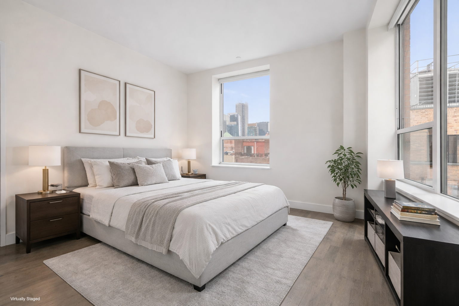 416 West 52nd Street, Unit 725 Manhattan, NY 10019 - Photo 5 of 15 a bedroom with a bed and a potted plant