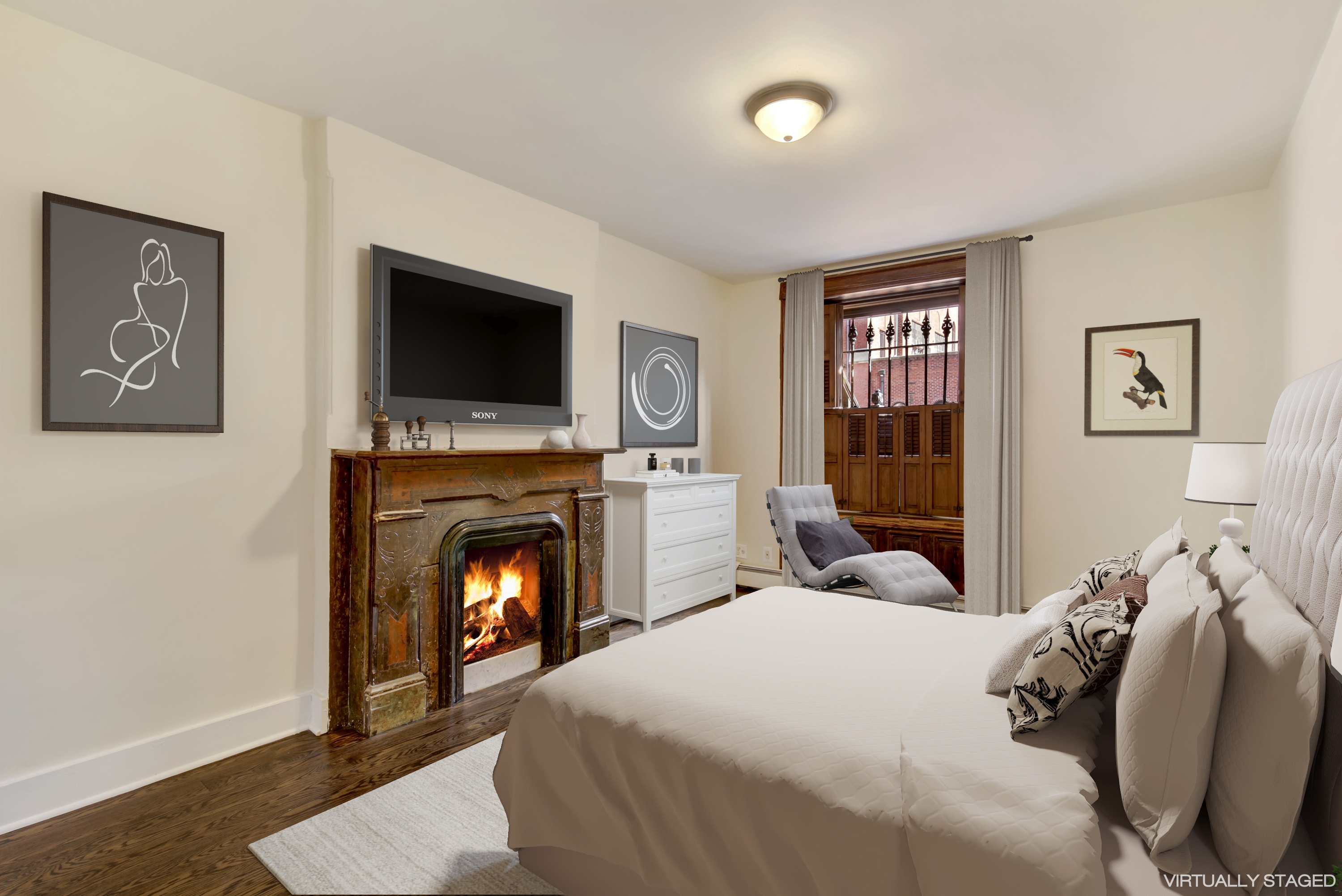 67 Gates Avenue, Unit 1 Brooklyn, NY 11238 - Photo 5 of 7 a bedroom with a bed and a fireplace