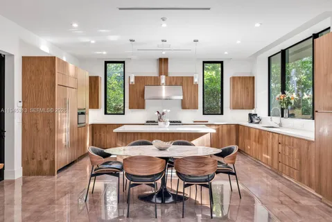 a view of a dining room with furniture window and outside view