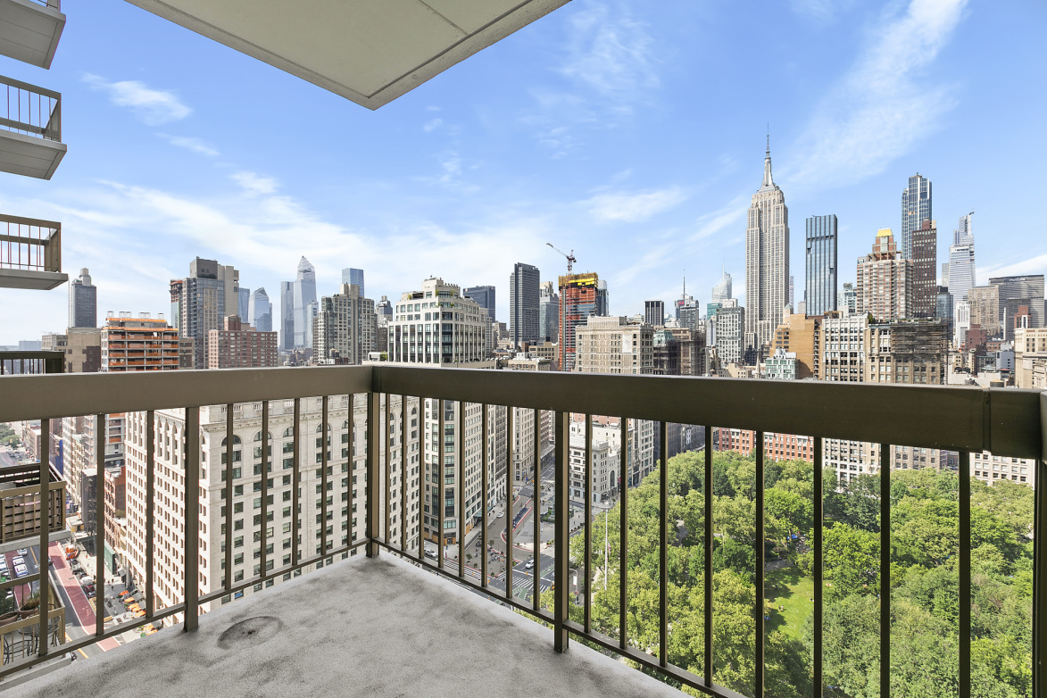 5 East 22nd Street, Unit 28M Manhattan, NY 10010 - Photo 2 of 11 a city view from a balcony