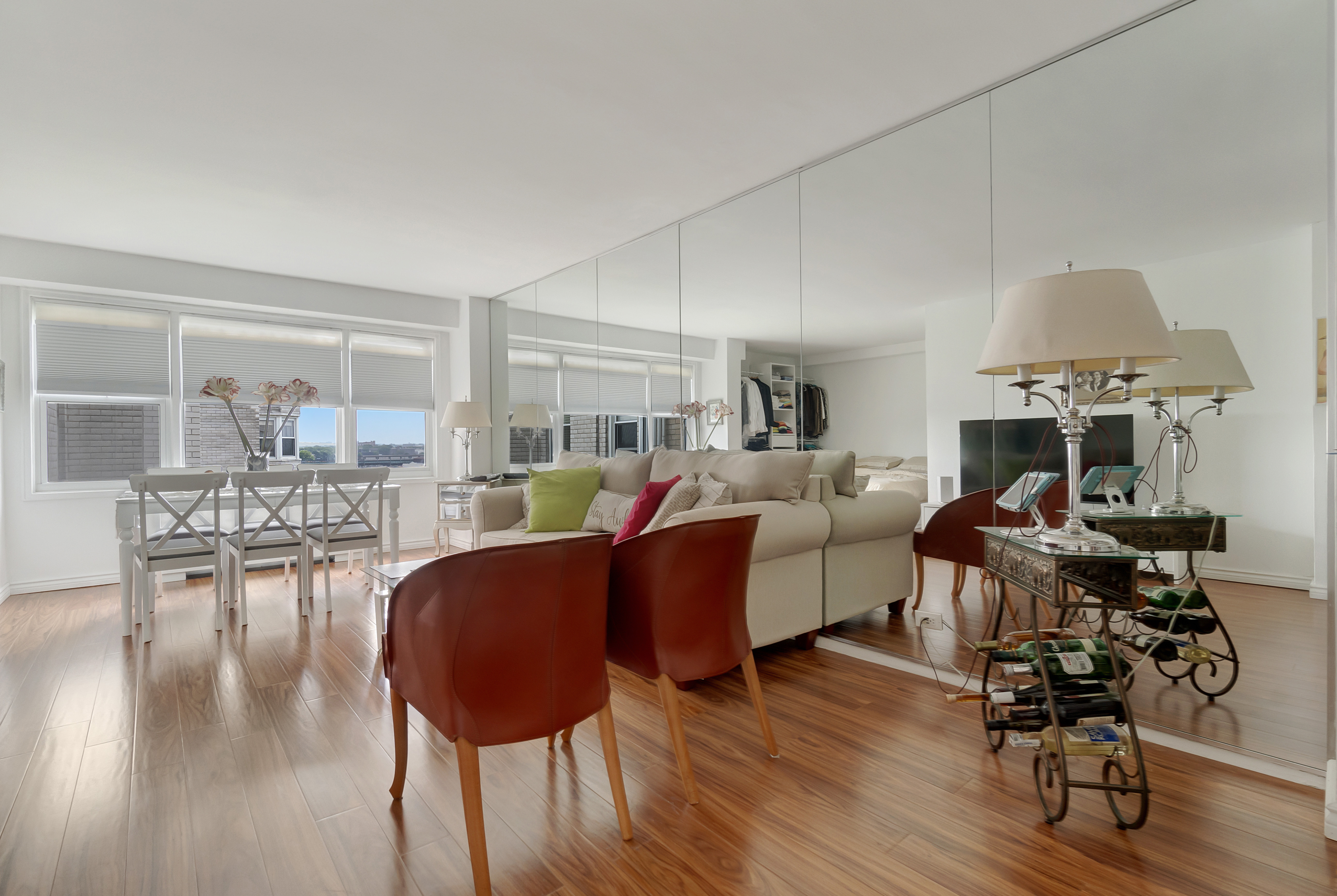 1170 Ocean Parkway, Unit 7A Brooklyn, NY 11230 - Photo 1 of 13 a living room with furniture a dining table and a large window