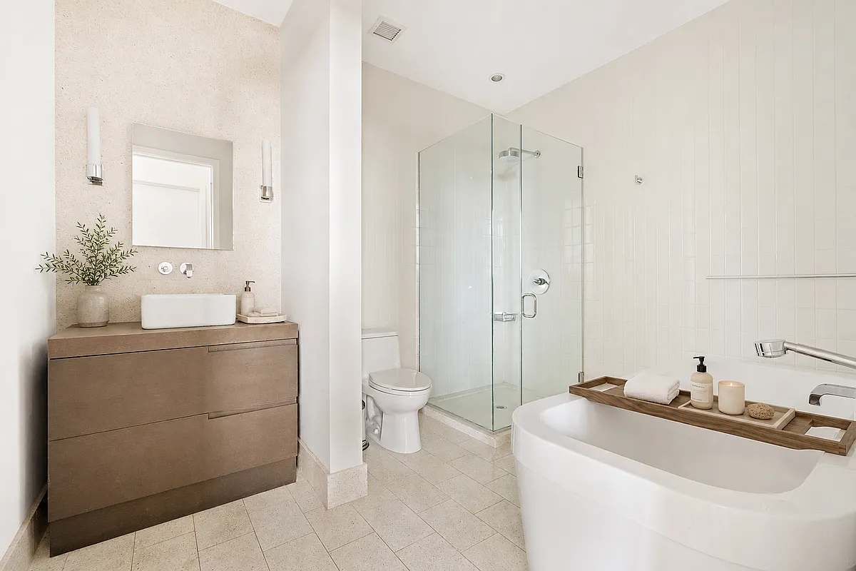 360 Furman Street, Unit 715 Brooklyn, NY 11201 - Photo 14 of 34 a bathroom with a sink toilet and shower