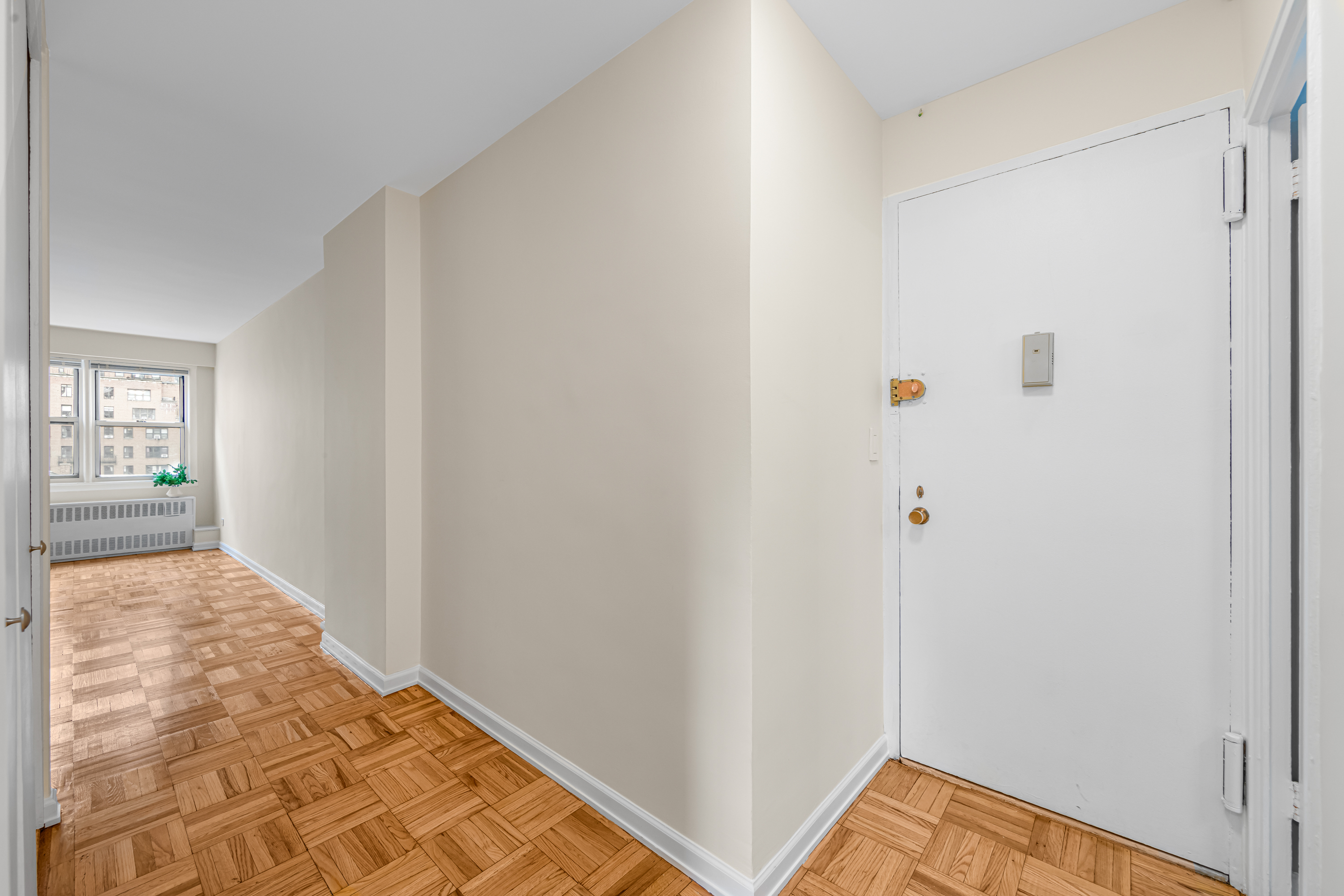 150 East 37th Street, Unit 10F Manhattan, NY 10016 - Photo 5 of 20 a view of hallway with wooden floor