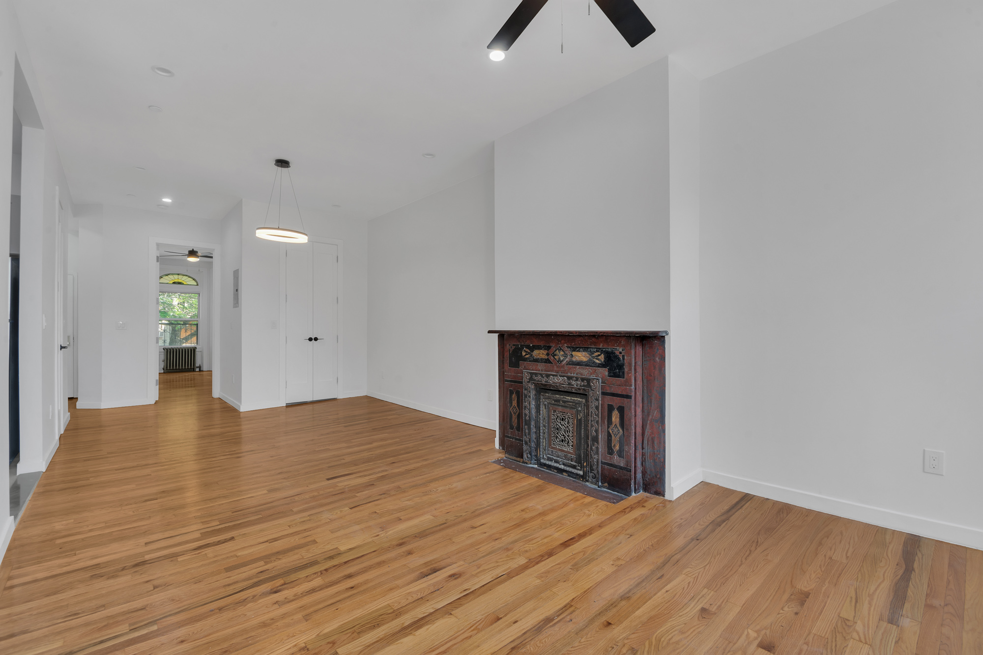 1275 Jefferson Avenue, Unit 2 Brooklyn, NY 11221 - Photo 2 of 11 a view of empty room with wooden floor and windows