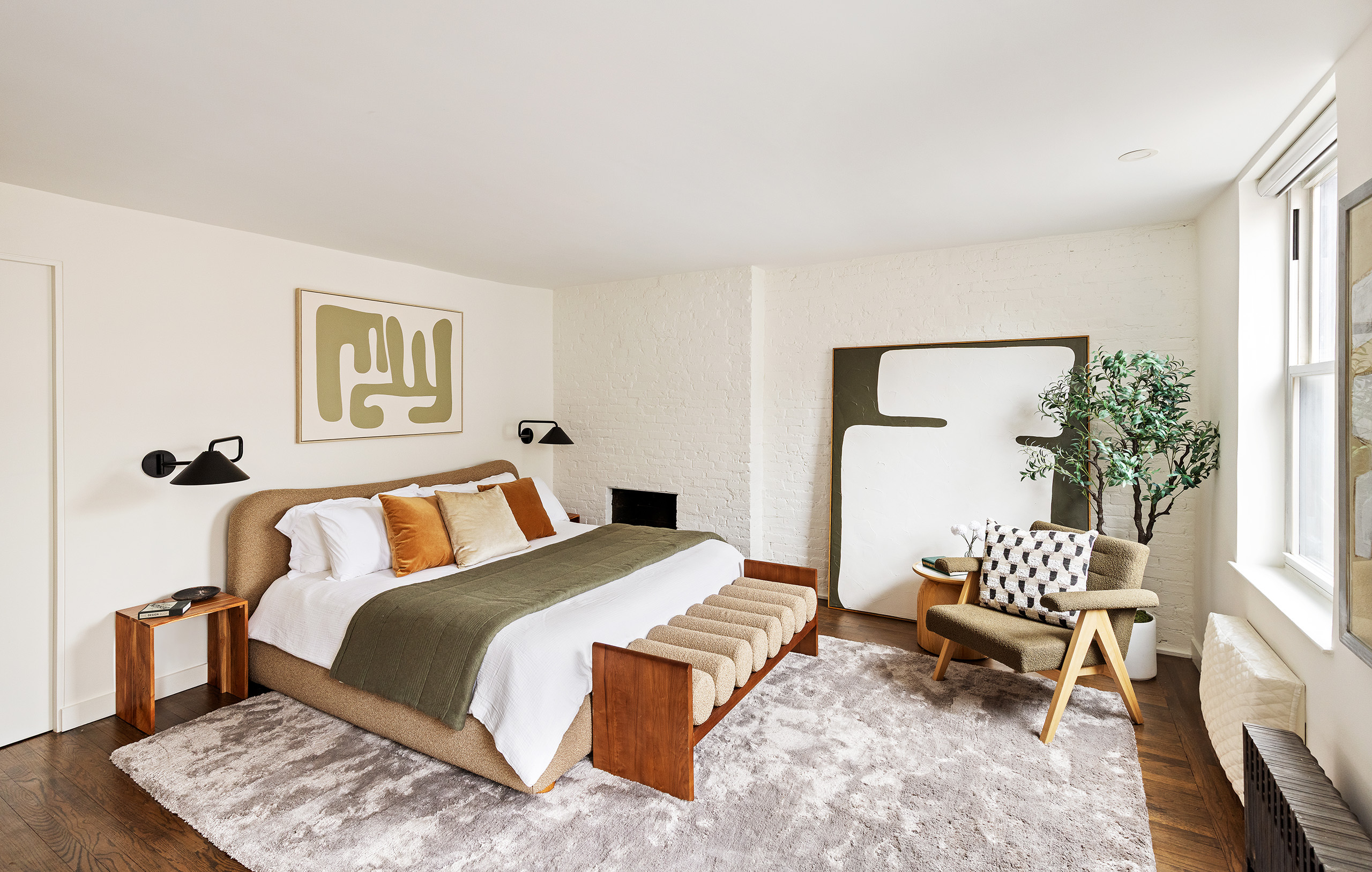 333 West 22nd Street, Unit 5A Manhattan, NY 10011 - Photo 4 of 12 a bedroom with a bed and a couch