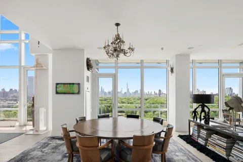 a dining room with furniture window wooden floor