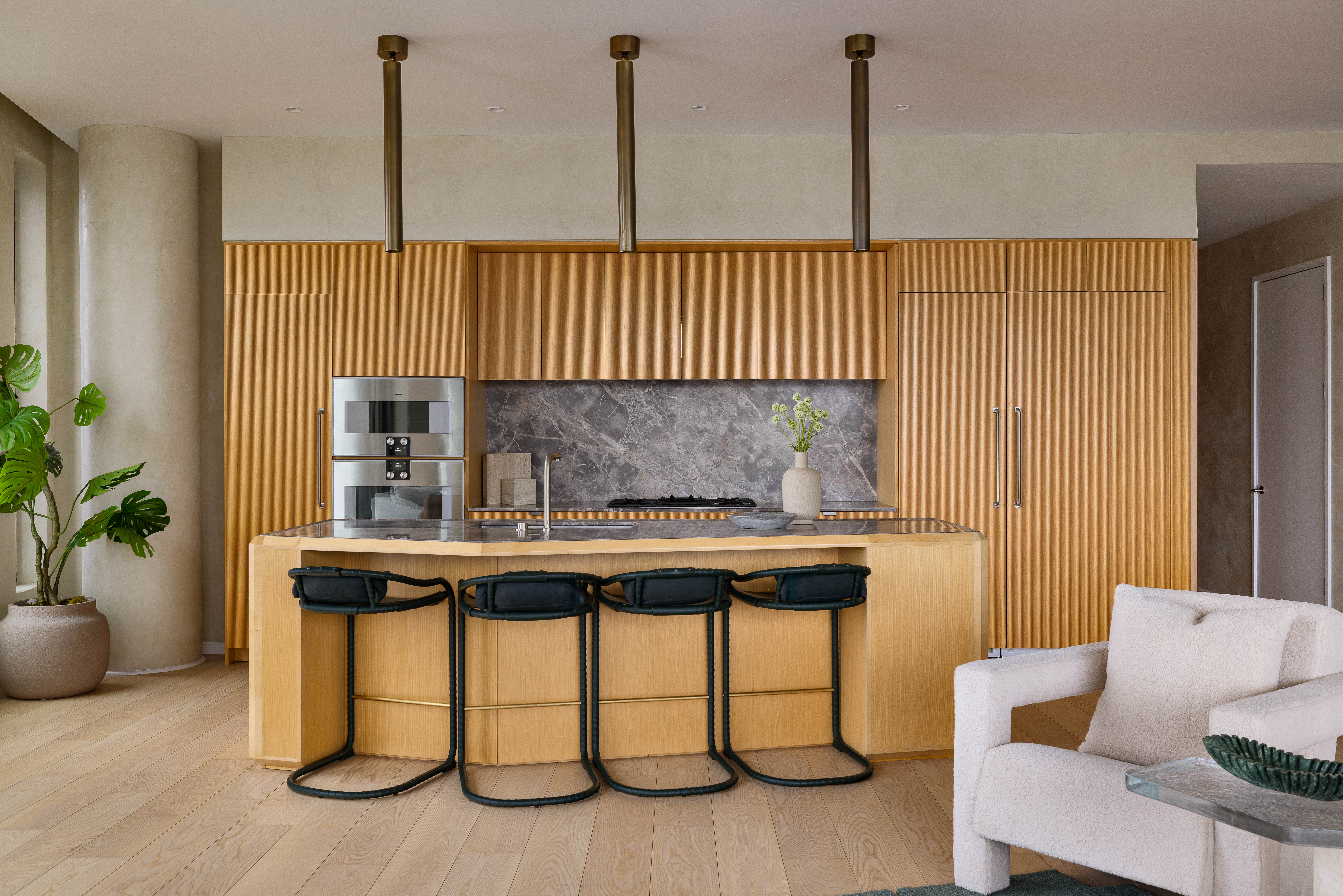 30 Front Street, Unit 21AD Brooklyn, NY 11201 - Photo 6 of 31 a kitchen with a table chairs and a potted plant