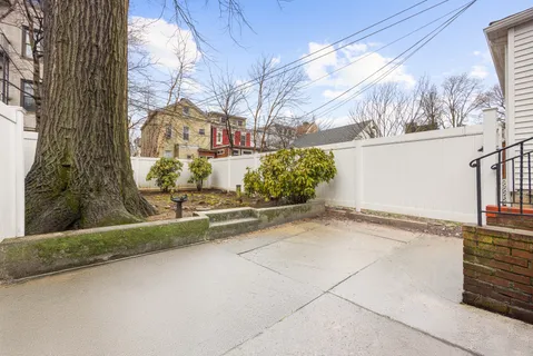 a view of a street with a building in the background