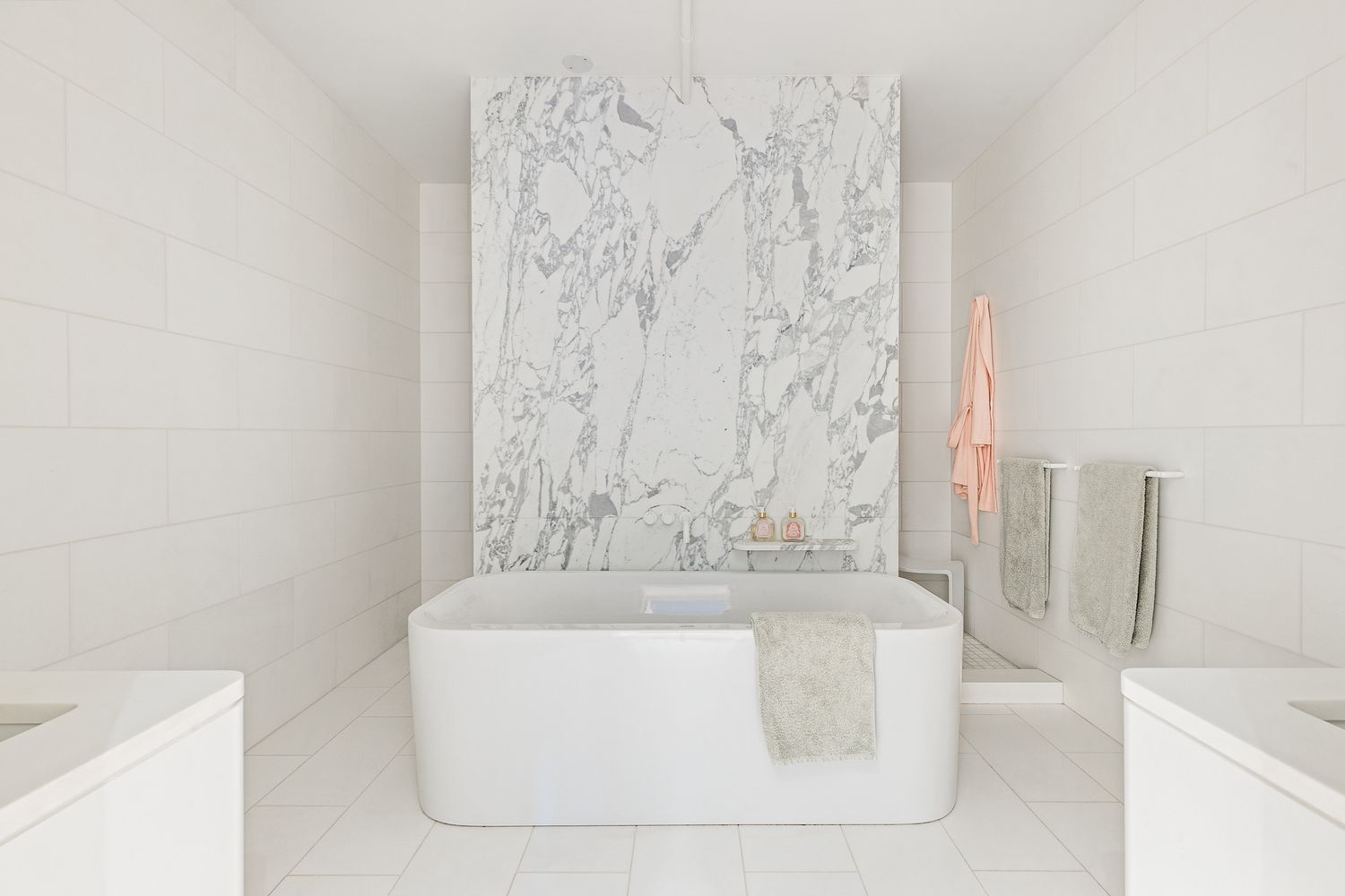 a bath tub sitting next to a white sink