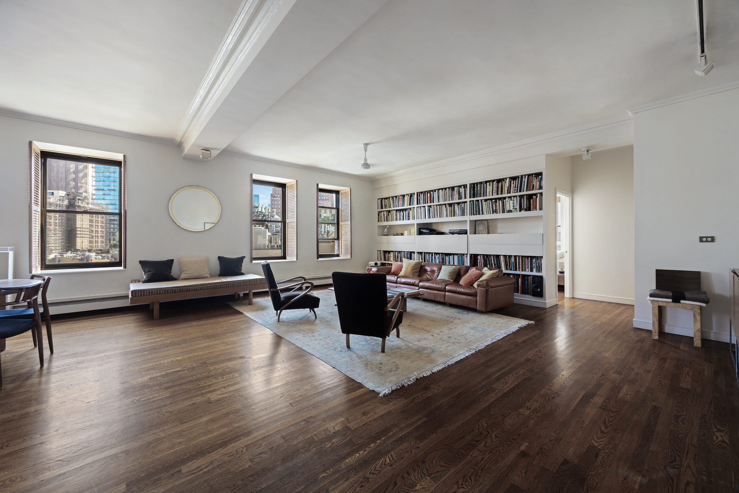 260 West Broadway, Unit 10D Manhattan, NY 10013 - Photo 2 of 20 a living room with furniture and wooden floor
