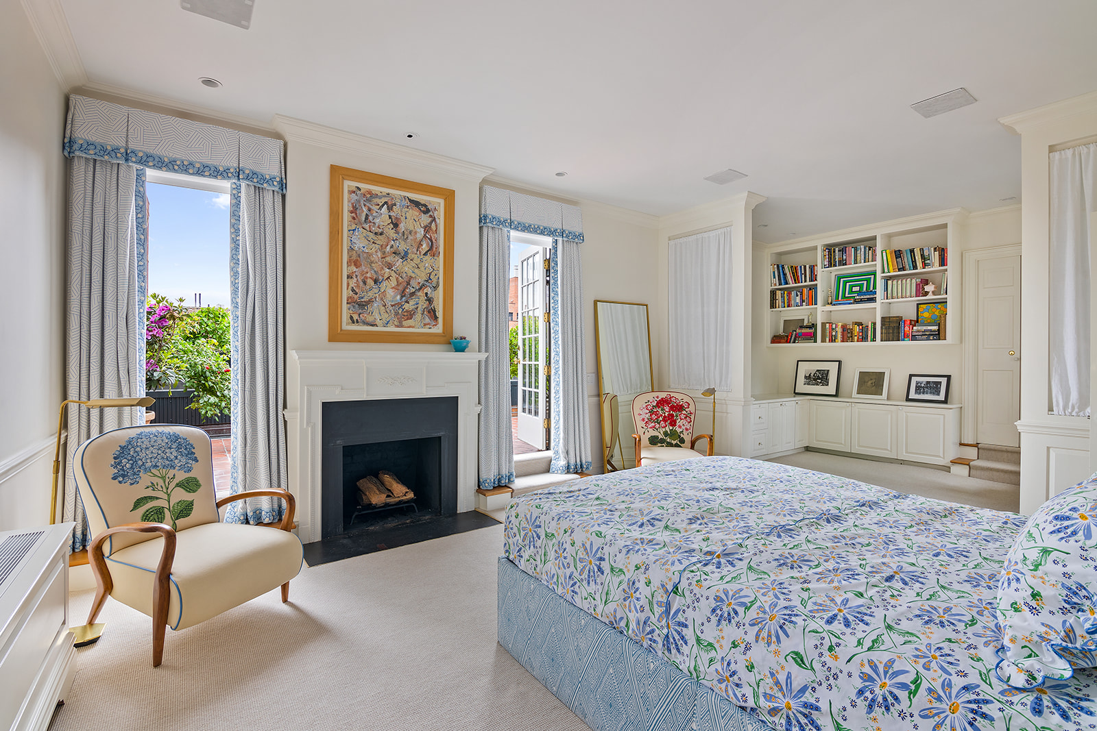 164 East 72nd Street, Unit PHC Manhattan, NY 10021 - Photo 7 of 17 a bedroom with a bed and a fireplace