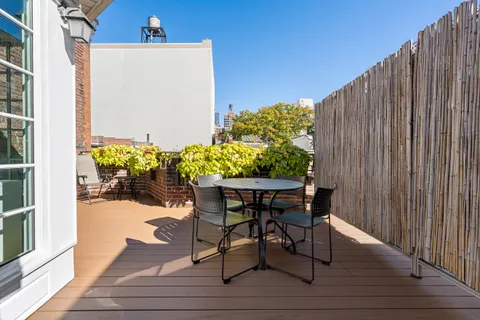 a view of a chairs and table on the wooden floor