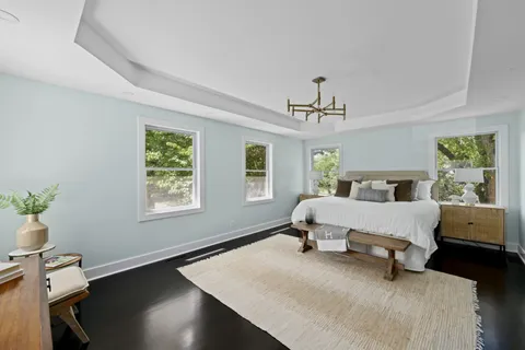 a spacious bathroom with a double vanity sink a mirror and a shower