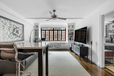 a view of a livingroom with furniture and a flat screen tv