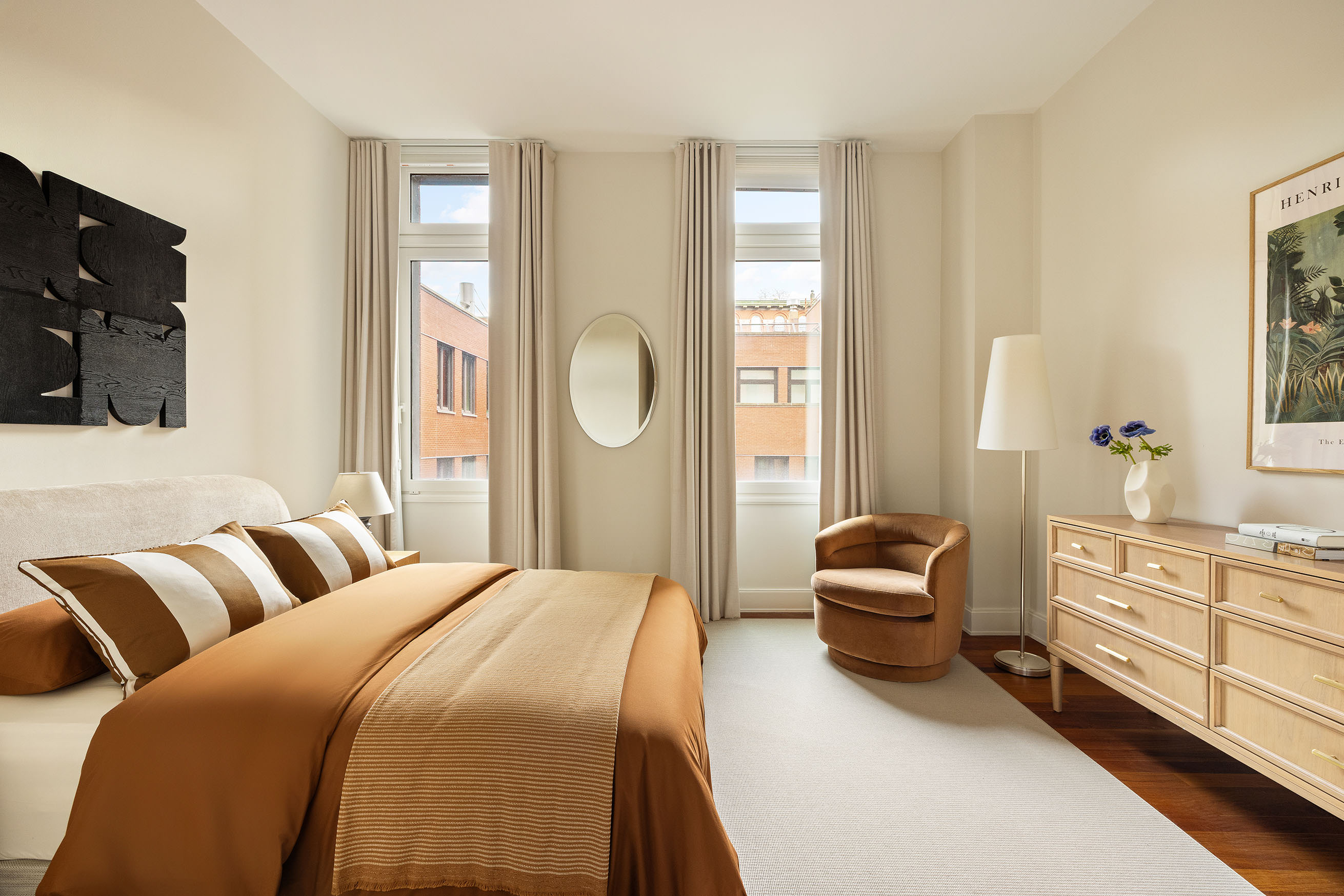 92 Laight Street, Unit 6D Manhattan, NY 10013 - Photo 11 of 15 a bedroom with a bed a couch and dresser