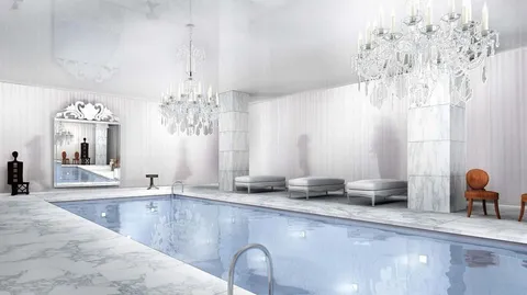 a view of a kitchen with granite countertop a sink and a chandelier
