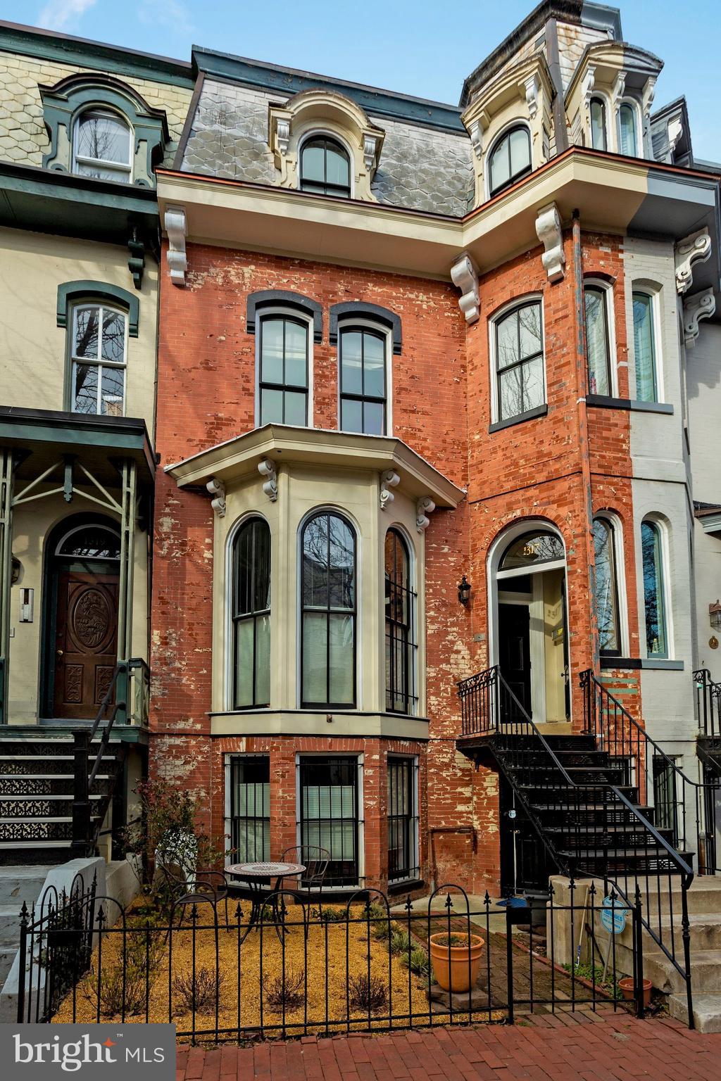 a front view of a brick building with many windows