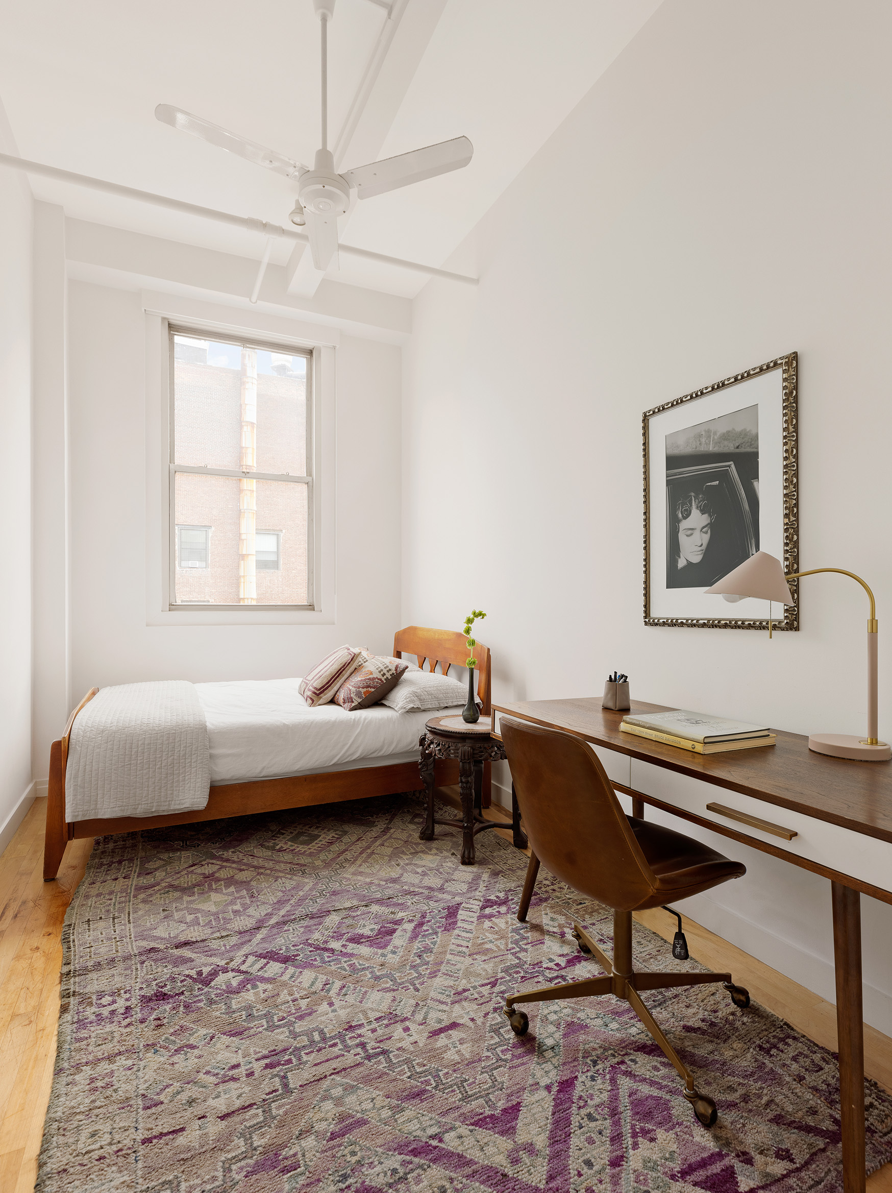 32 West 20th Street, Unit 9B Manhattan, NY 10011 - Photo 13 of 16 a living room with a couch and a window