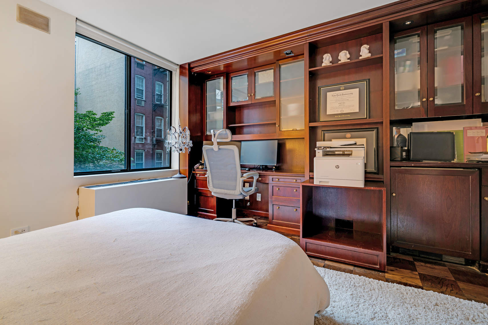 309 East 49th Street, Unit 2B3B Manhattan, NY 10017 - Photo 11 of 16 a bedroom with a bed table and chair