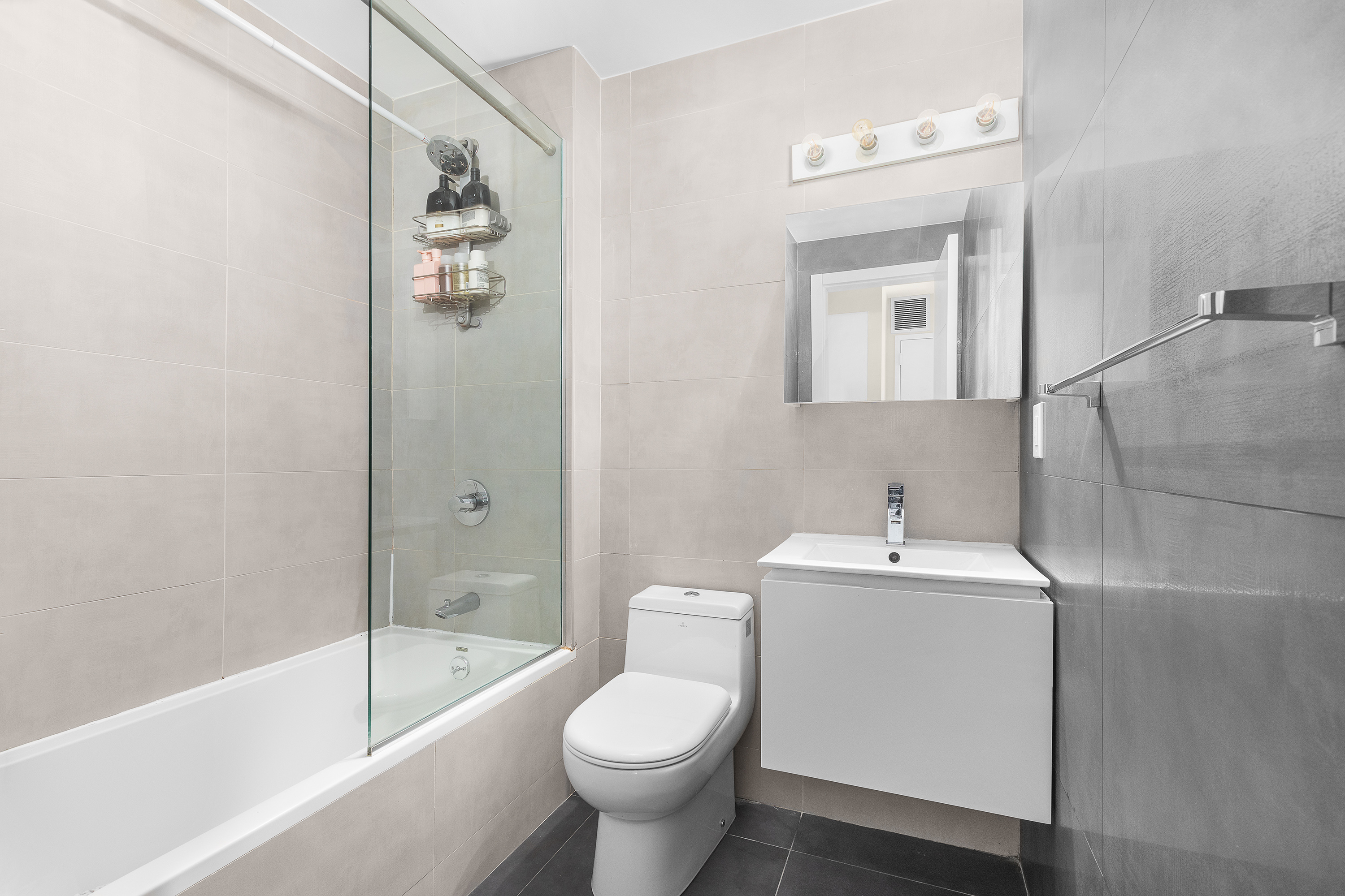 364 Lafayette Avenue, Unit 4A Brooklyn, NY 11238 - Photo 7 of 12 a bathroom with a sink toilet and bathtub