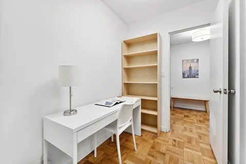 a view of a workspace with furniture