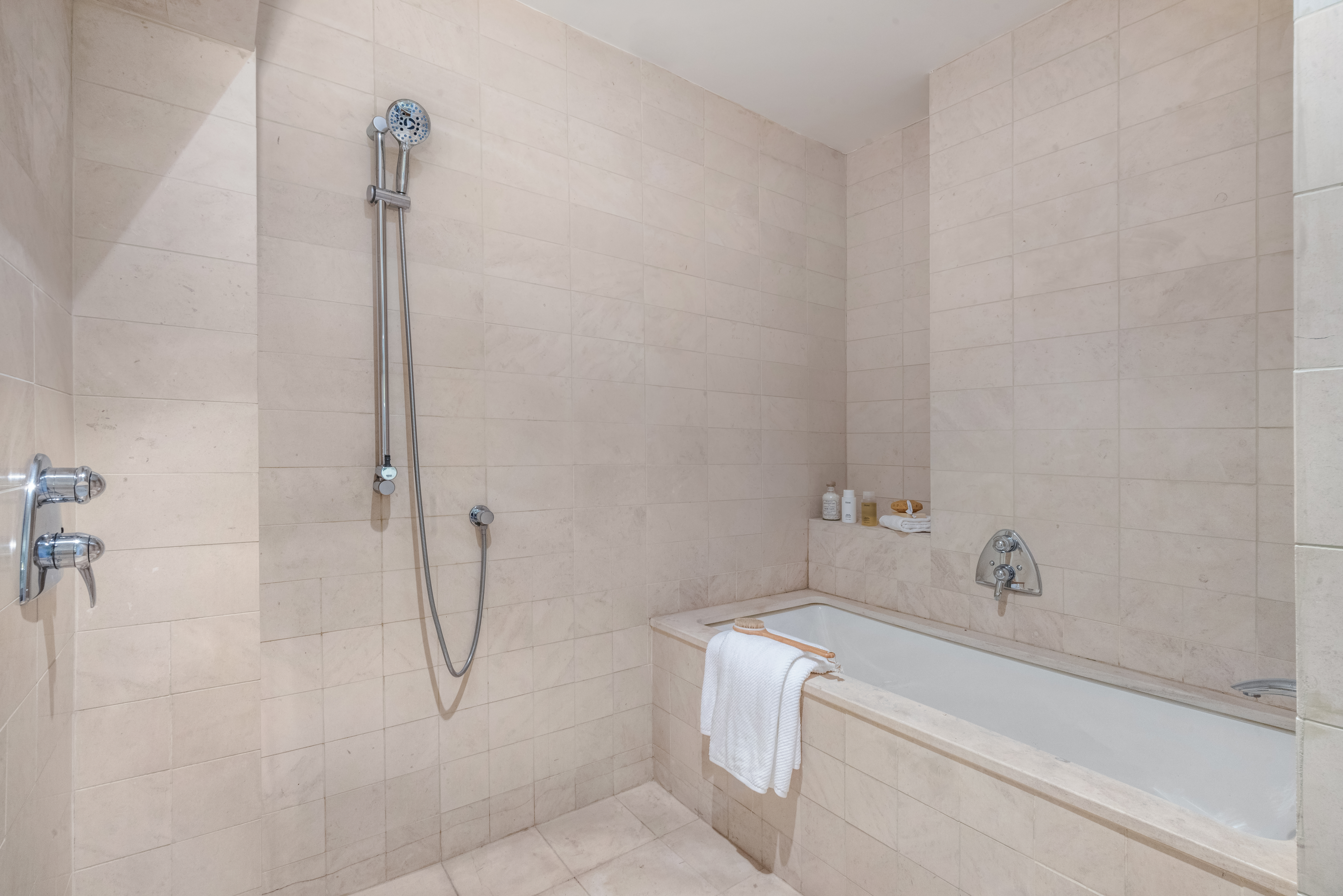 170 5th Avenue, Unit 5 Manhattan, NY 10010 - Photo 17 of 22 a bathroom with a bath tub with a shower