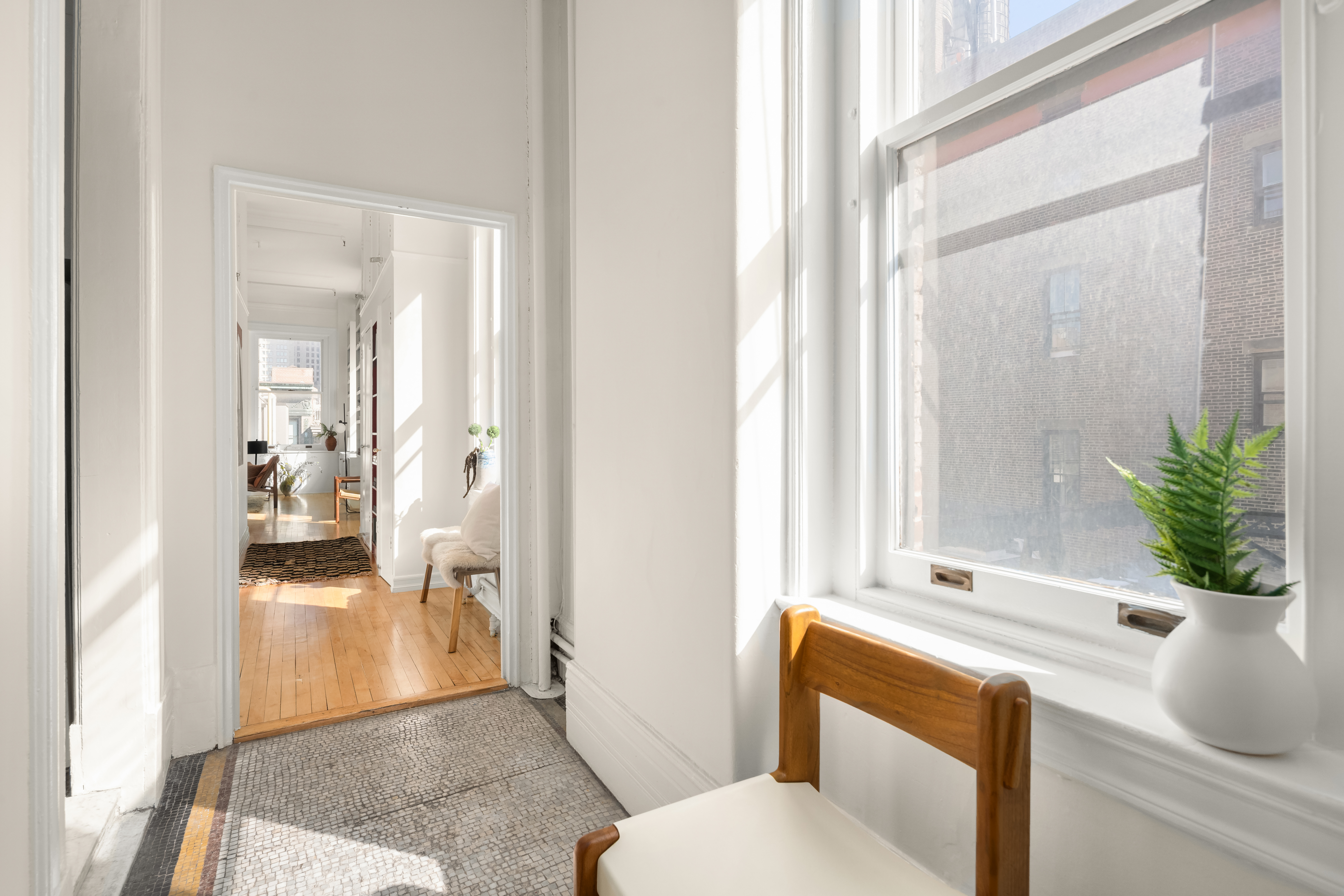 874 Broadway, Unit 907 Manhattan, NY 10003 - Photo 7 of 14 a living room with furniture and a potted plant