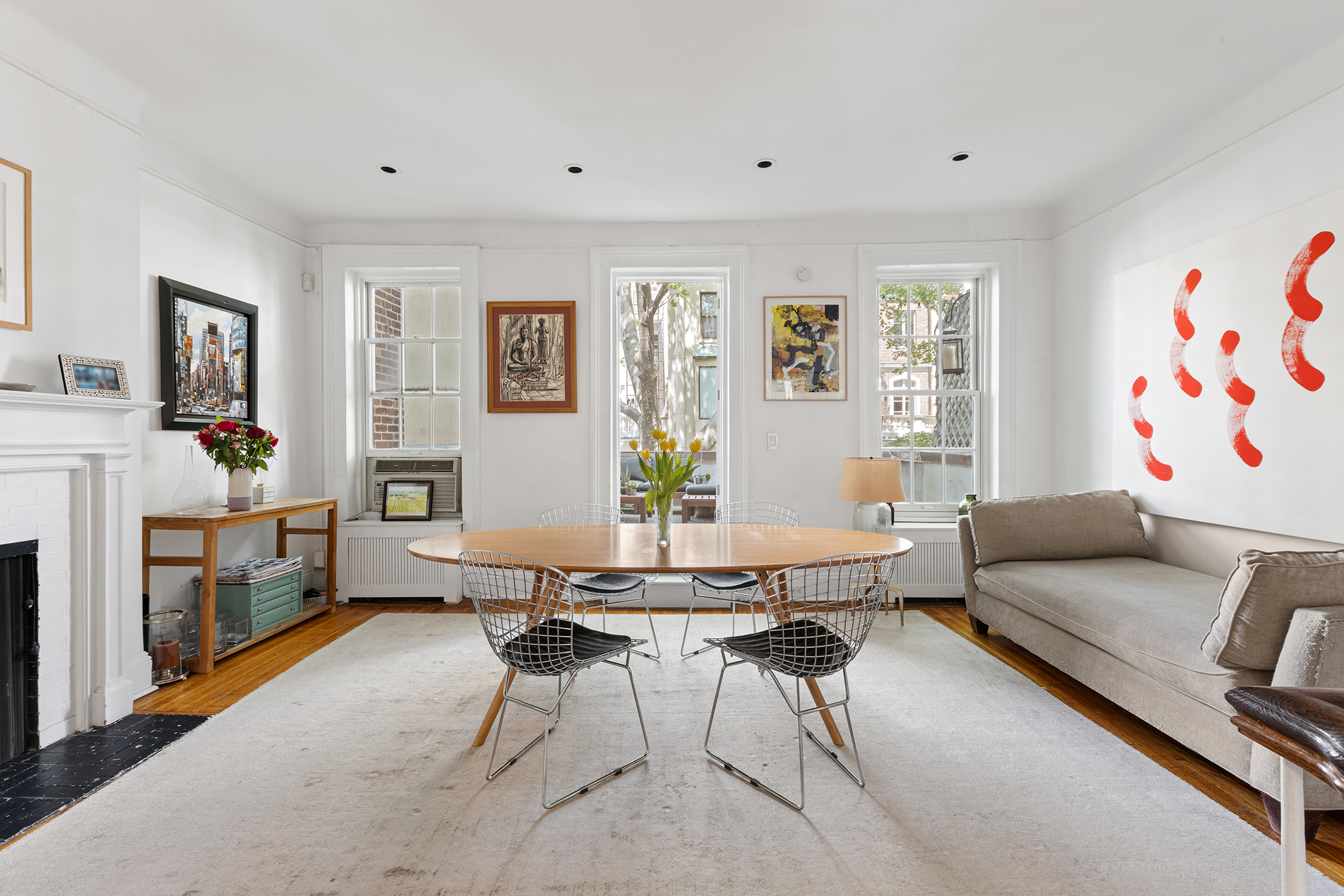 159 East 63rd Street, Unit 2/3 Manhattan, NY 10065 - Photo 3 of 13 a living room with furniture and a flat screen tv