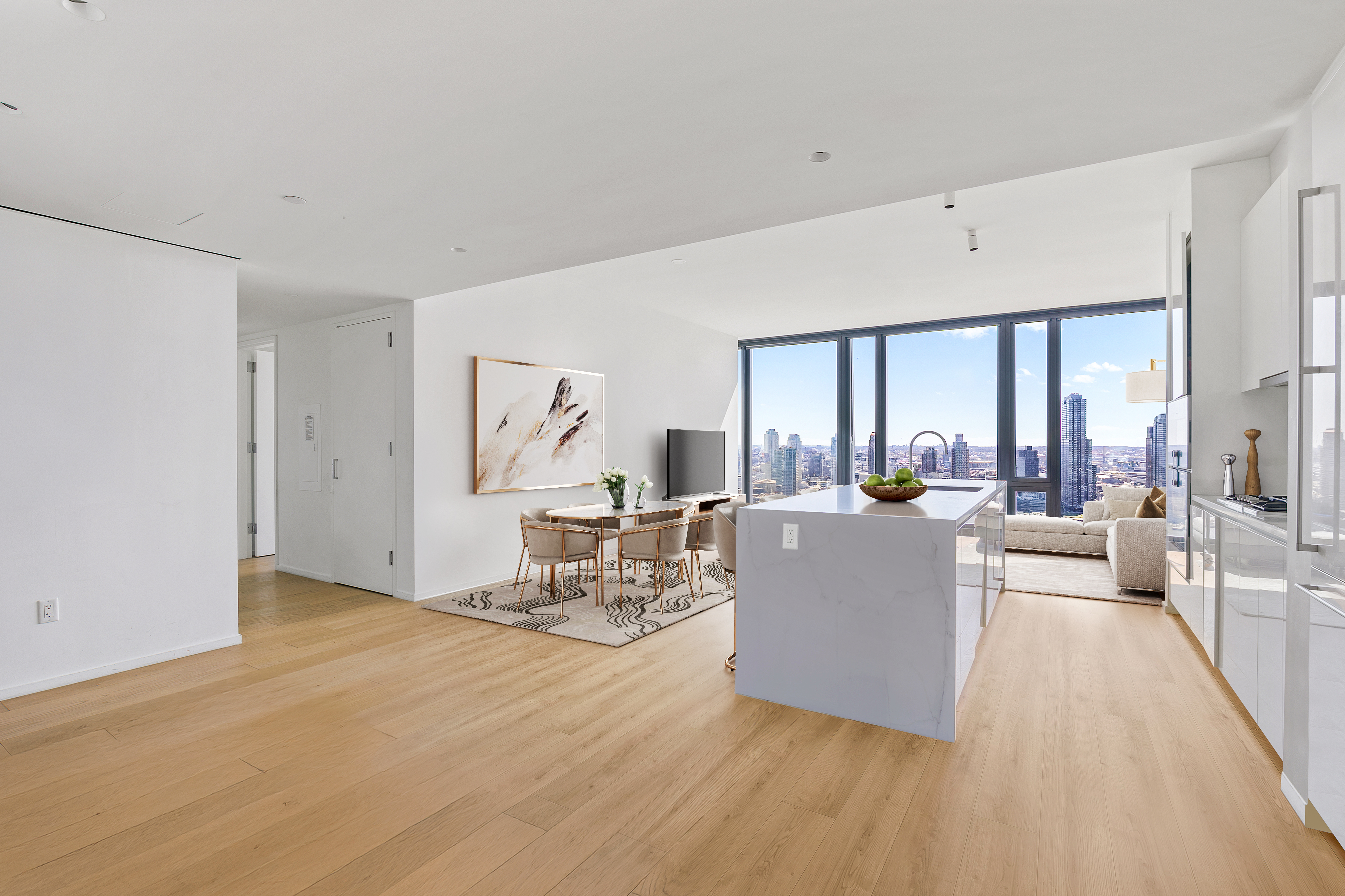 695 1st Avenue, Unit 33B Manhattan, NY 10016 - Photo 3 of 25 a living room with furniture and a large window