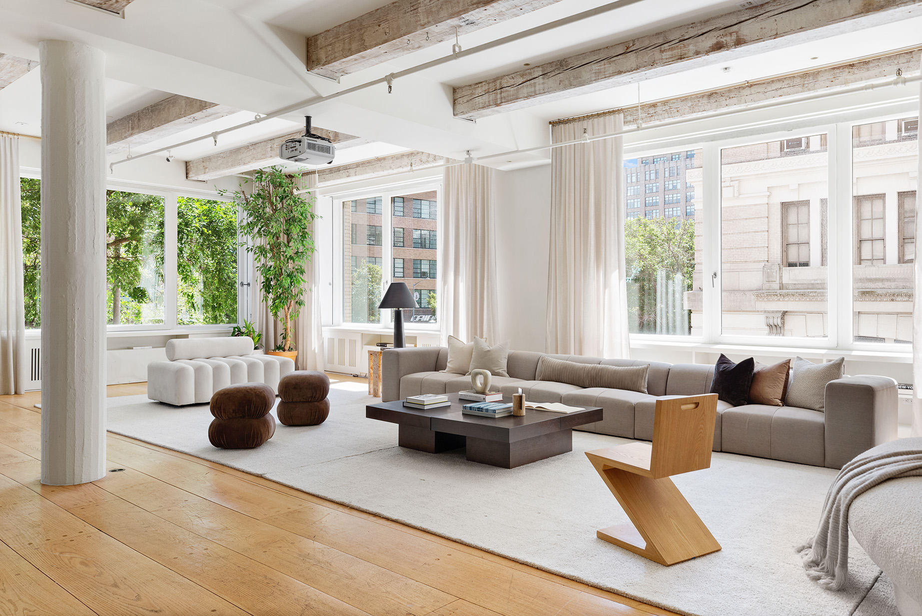 145 6th Avenue, Unit 2B Manhattan, NY 10013 - Photo 9 of 23 a living room with furniture and a large window