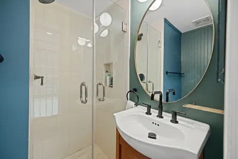 a bathroom with a sink and mirror