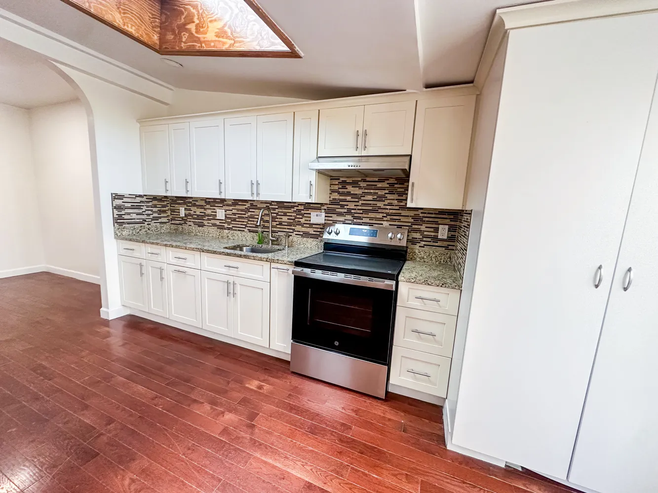 a kitchen with a stove and a microwave