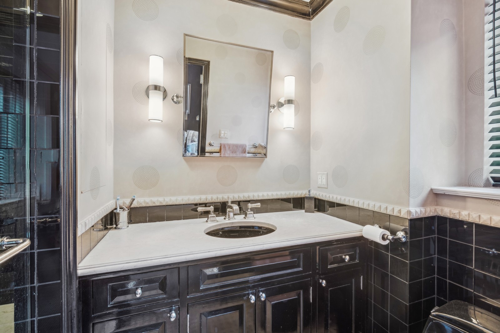 333 East 57th Street, Unit 4F Manhattan, NY 10022 - Photo 8 of 9 a bathroom with a sink and a mirror