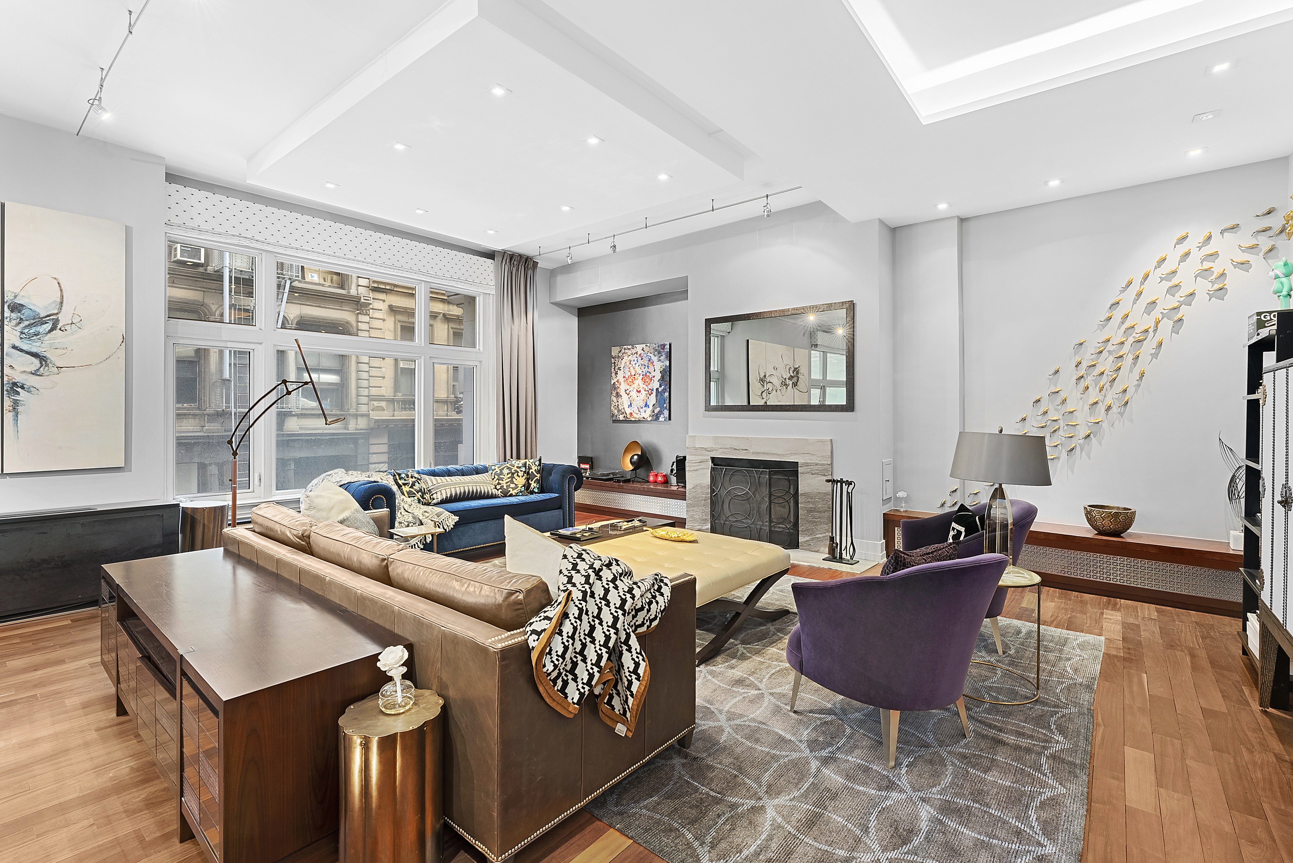 66 Leonard Street, Unit 2A Manhattan, NY 10013 - Photo 4 of 15 a living room with fireplace furniture and a large window