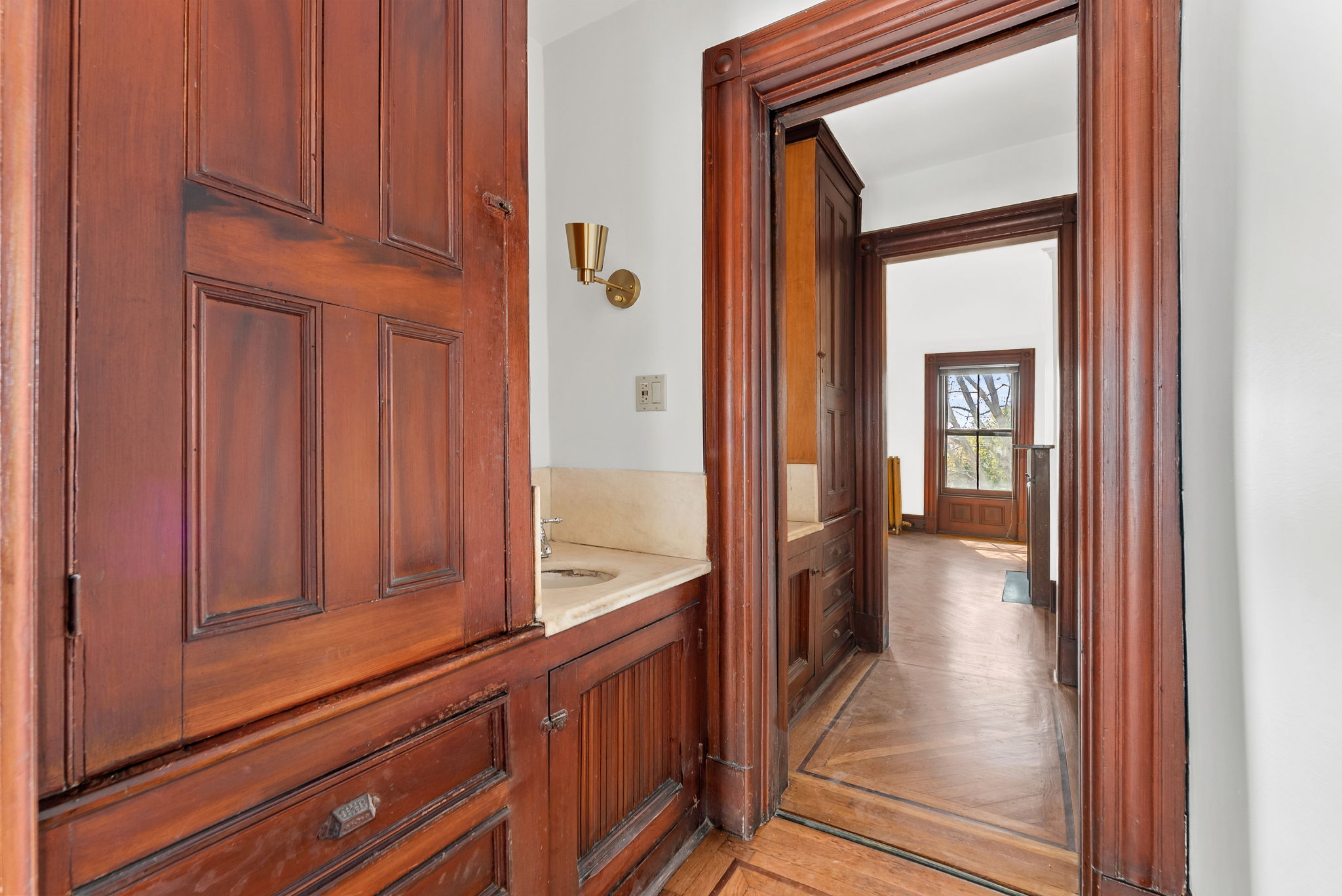 694 10th Street, Unit 2 Brooklyn, NY 11215 - Photo 13 of 22 a view of a hallway with wooden floor and staircase