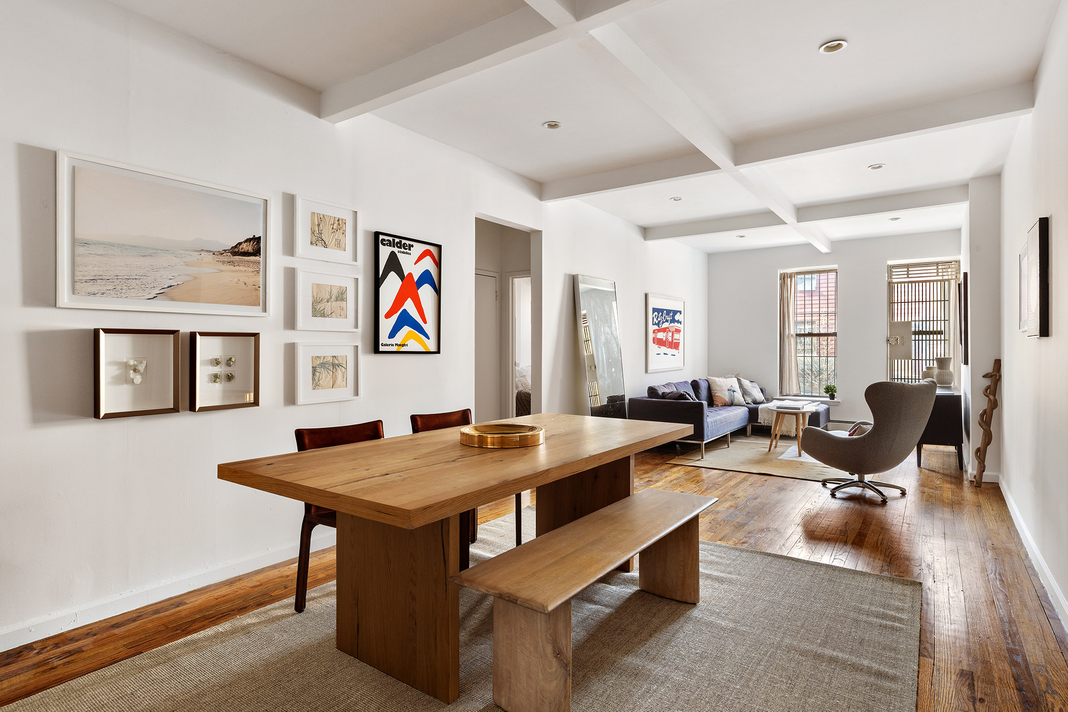 a room with furniture pool table and windows